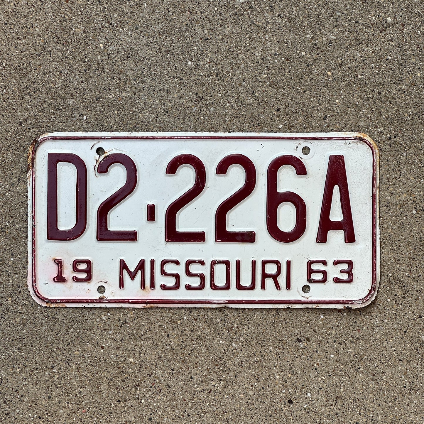 Photo of a 1963 Missouri Dealer License Plate Auto Tag Garage Decor Vintage Repeat Repeating D 222 6A