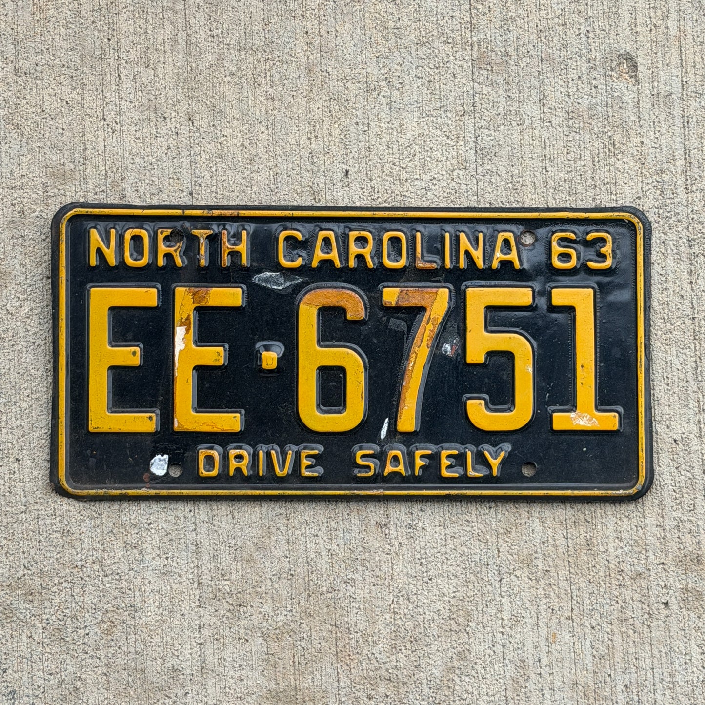 Photo of a 1963 North Carolina License Plate Auto Tag Garage Decor Vintage EE 6751 with original patina