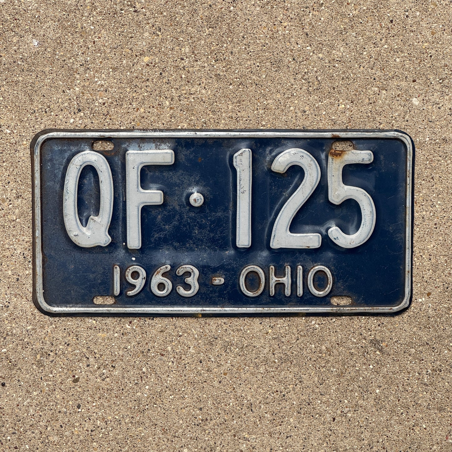 Photo of a 1963 Ohio License Plate Auto Tag 2 Vintage Garage QF 125 with original patina