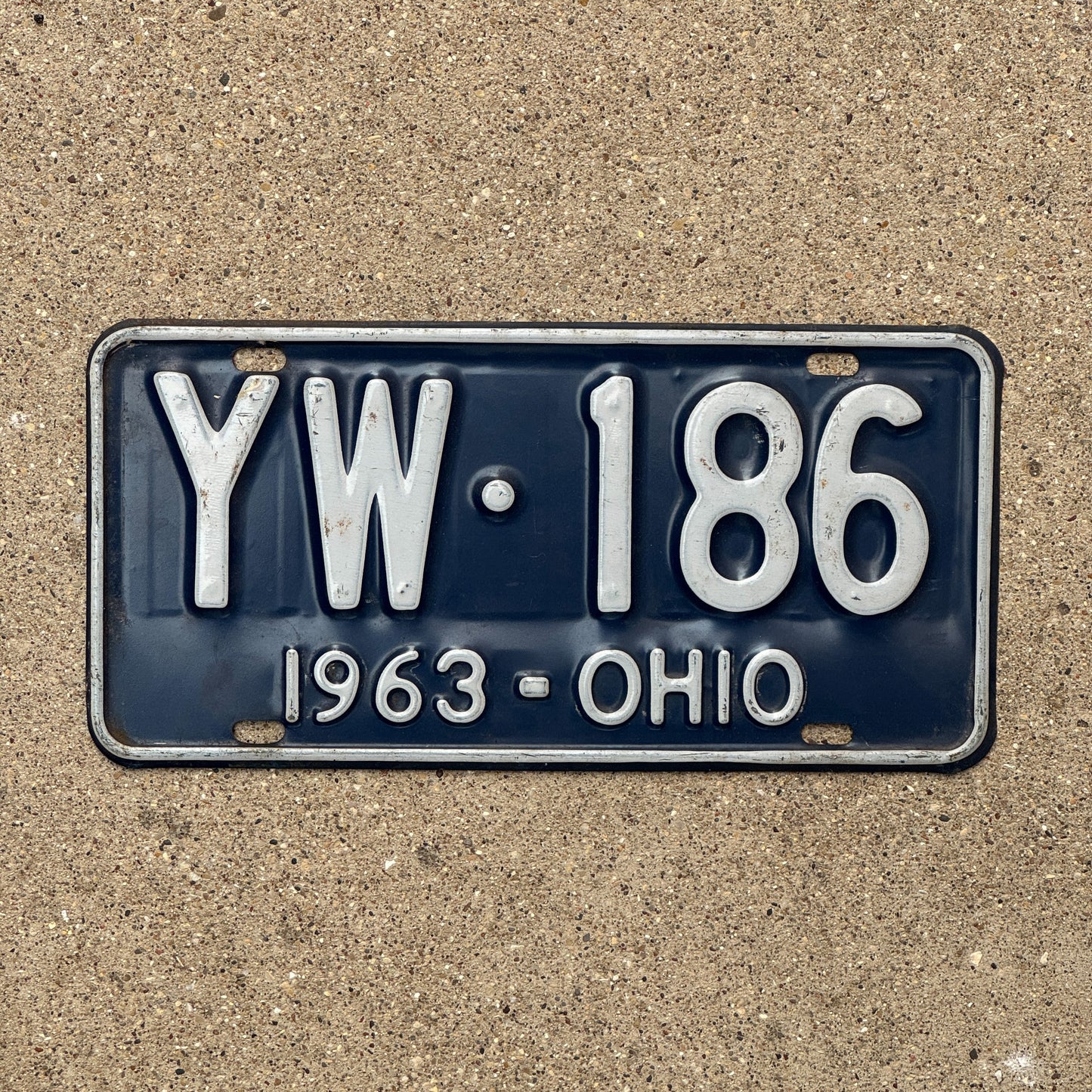 Photo of a 1963 Ohio License Plate Auto Tag Garage Decor Vintage YW 186 with original patina