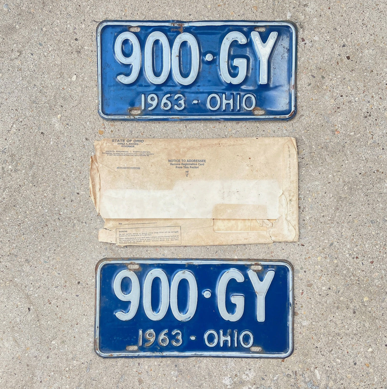 Photo of a 1963 Ohio License Plate Pair Auto Tag Garage Decor Vintage With Envelope 900 GY with original patina