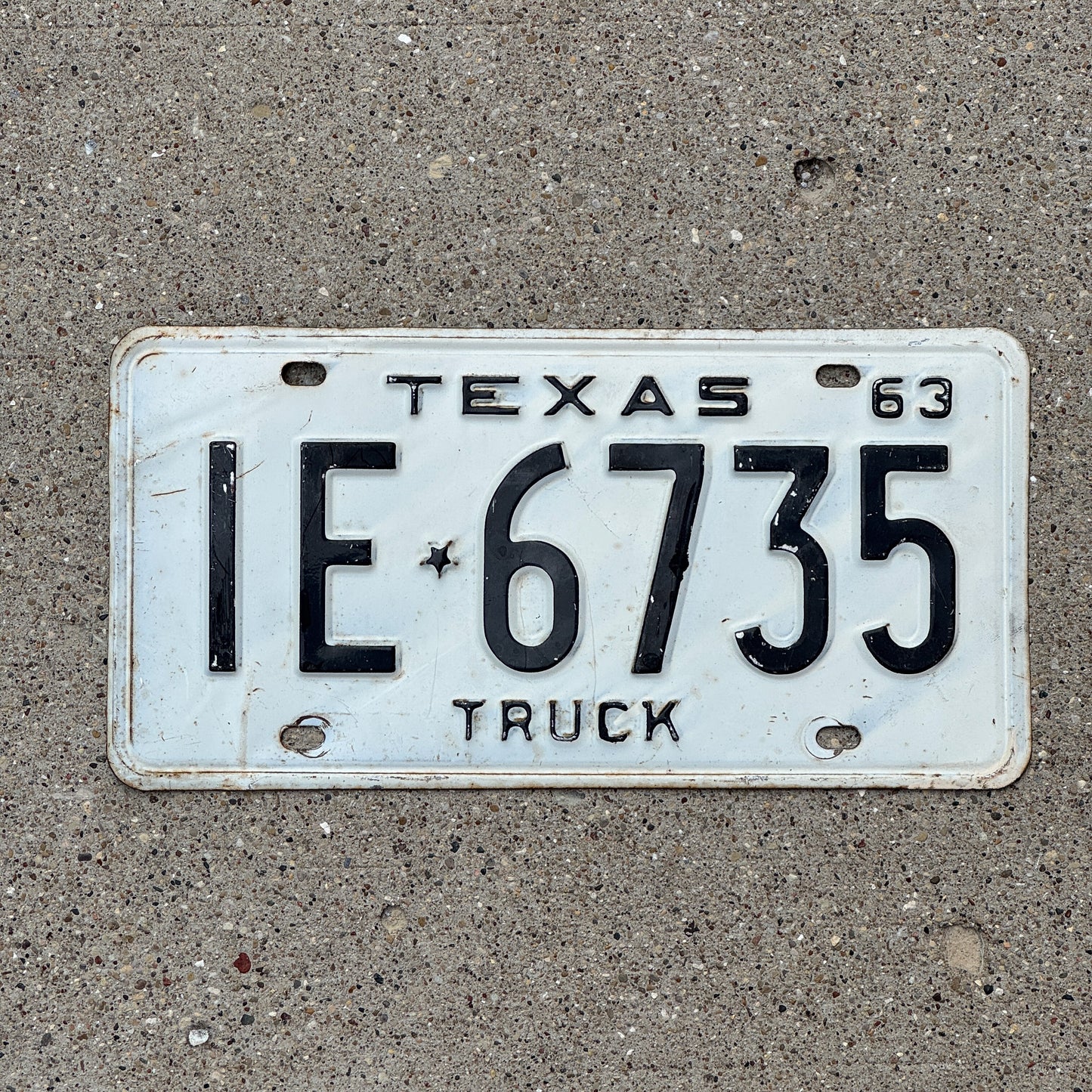 Photo of a 1963 Texas Truck License Plate Auto Tag Garage Decor Vintage IE 6735 with original patina