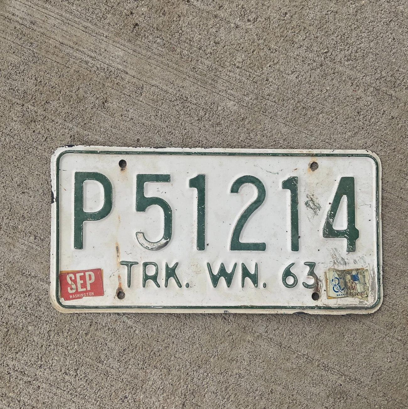 Photo of a 1963 Washington License Plate Auto Tag Garage Decor Vintage YOM DMV Clear P 51214 with original patina