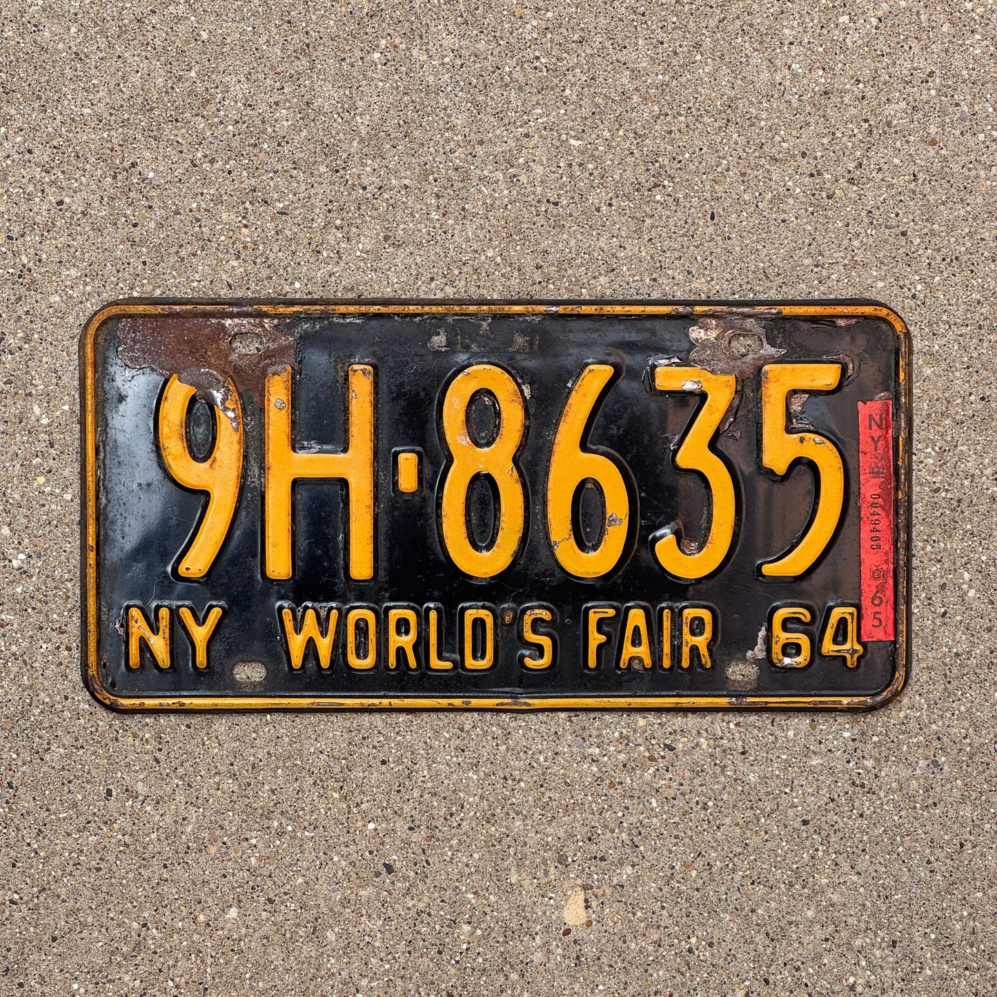 Photo of a 1964 1965 New York Special Omnibus License Plate Auto Tag Garage Decor Vintage World's Fair Bus 9H 8635 with original patina