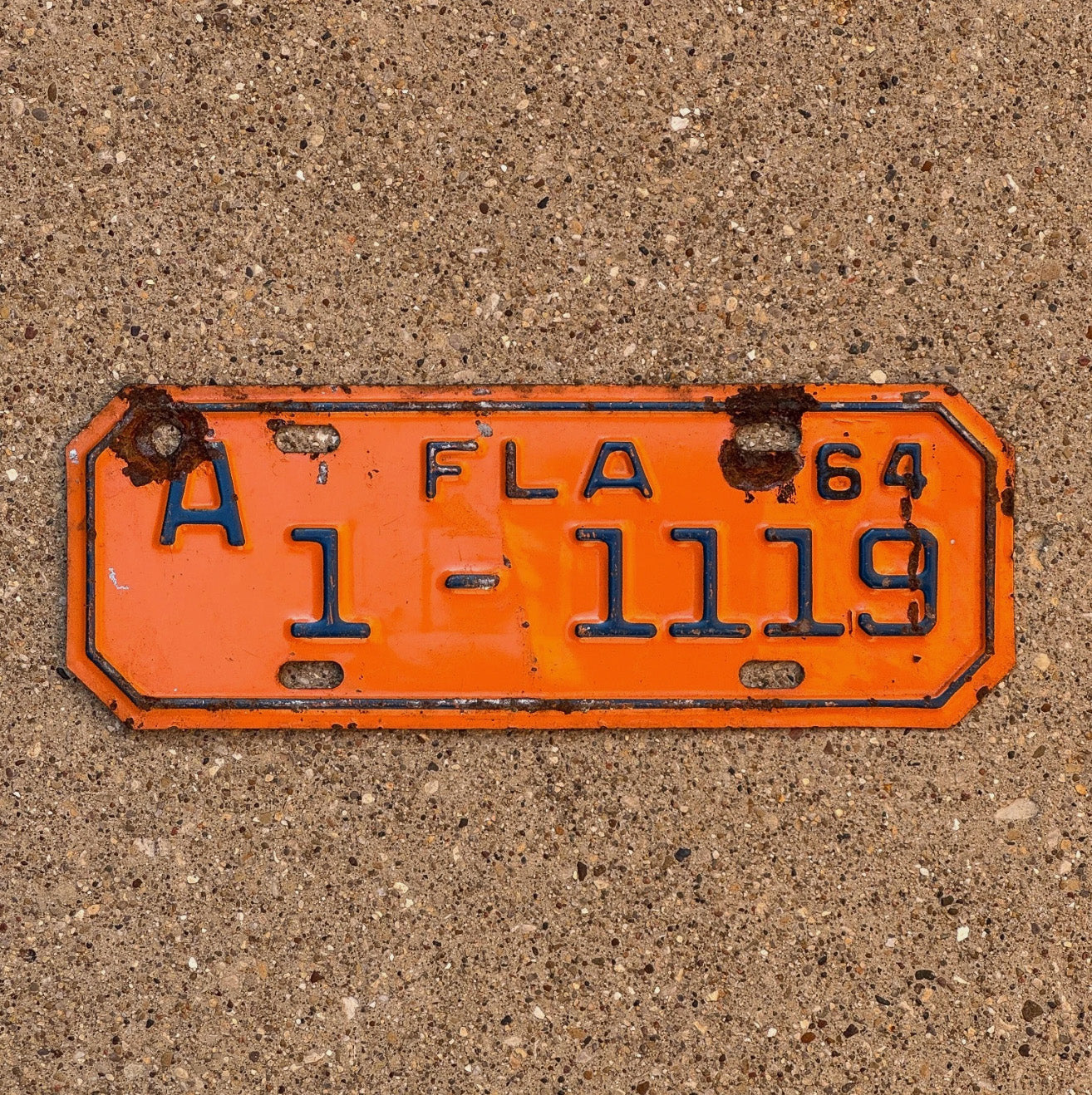Photo of a 1964 Florida Motorcycle License Plate Auto Tag Garage Decor Vintage Repeat Repeating 1 1119 with original patina