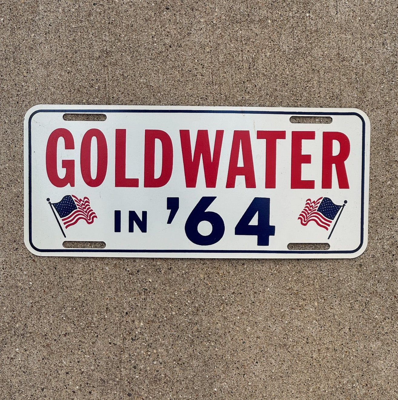 Photo of a 1964 Goldwater for President Booster License Plate Auto Tag Garage Decor Vintage Political Politics USA Flag Goldwater in '64 with original patina