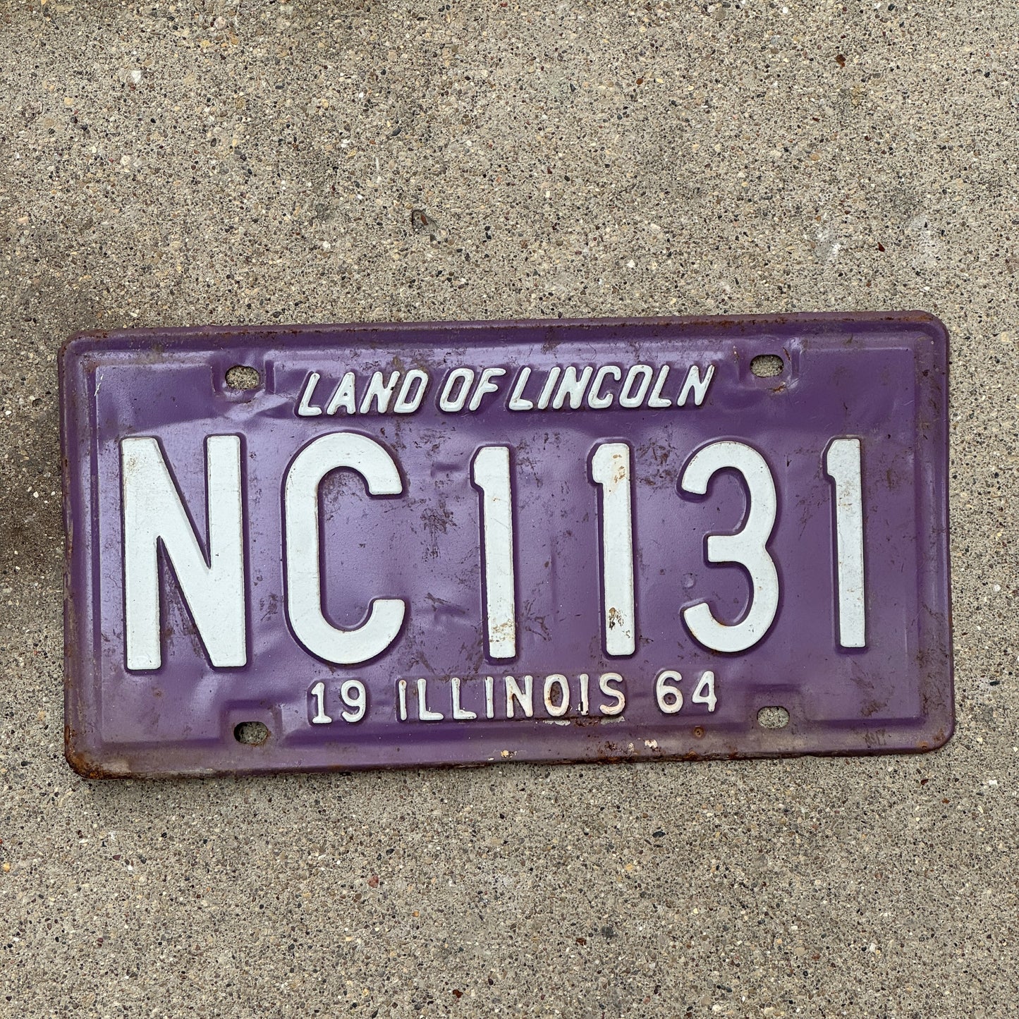 Photo of a 1964 Illinois License Plate Auto Tag 1 Vintage Garage Purple NC 1131 with original patina
