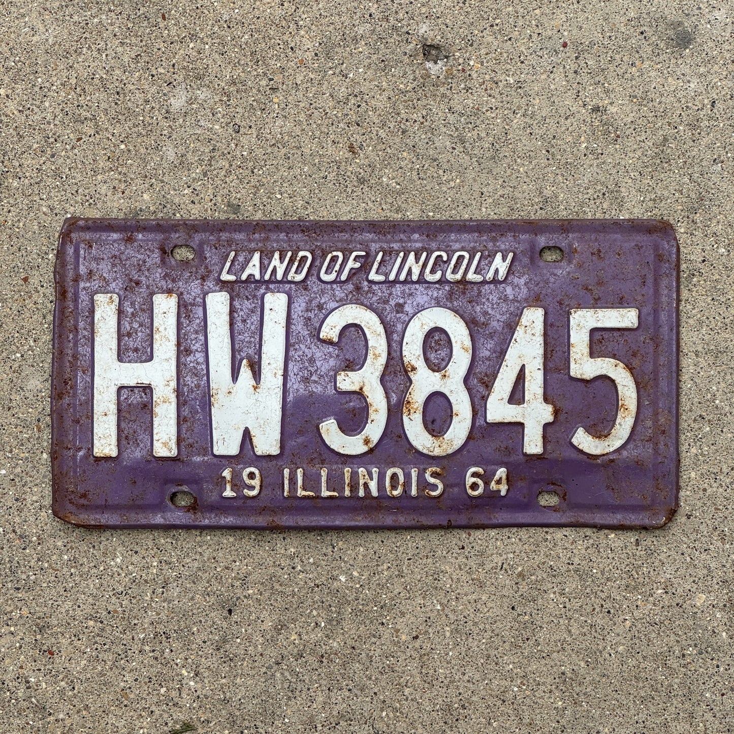 Photo of a 1964 Illinois License Plate Auto Tag 2 Vintage Garage Purple HW 3845 with original patina