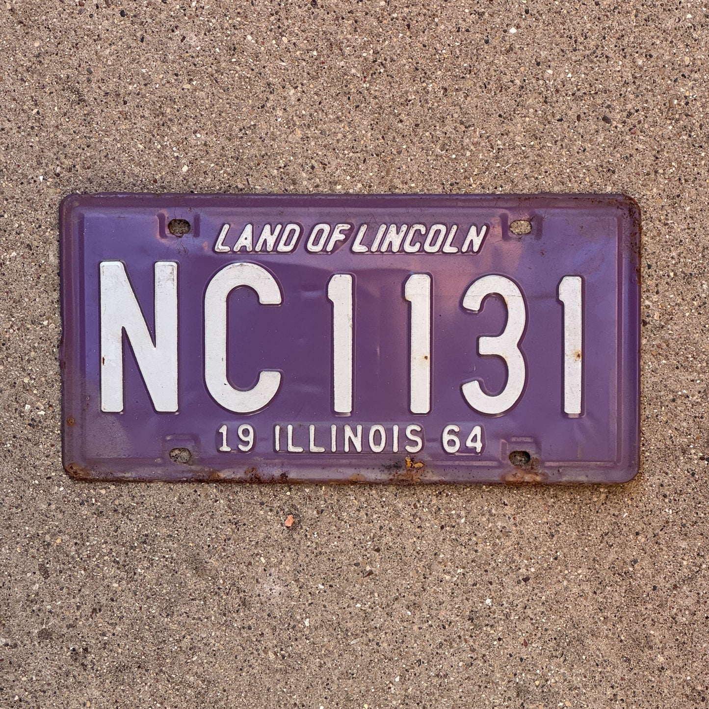 Photo of a 1964 Illinois License Plate Auto Tag 2 Vintage Garage Purple NC 1131 with original patina