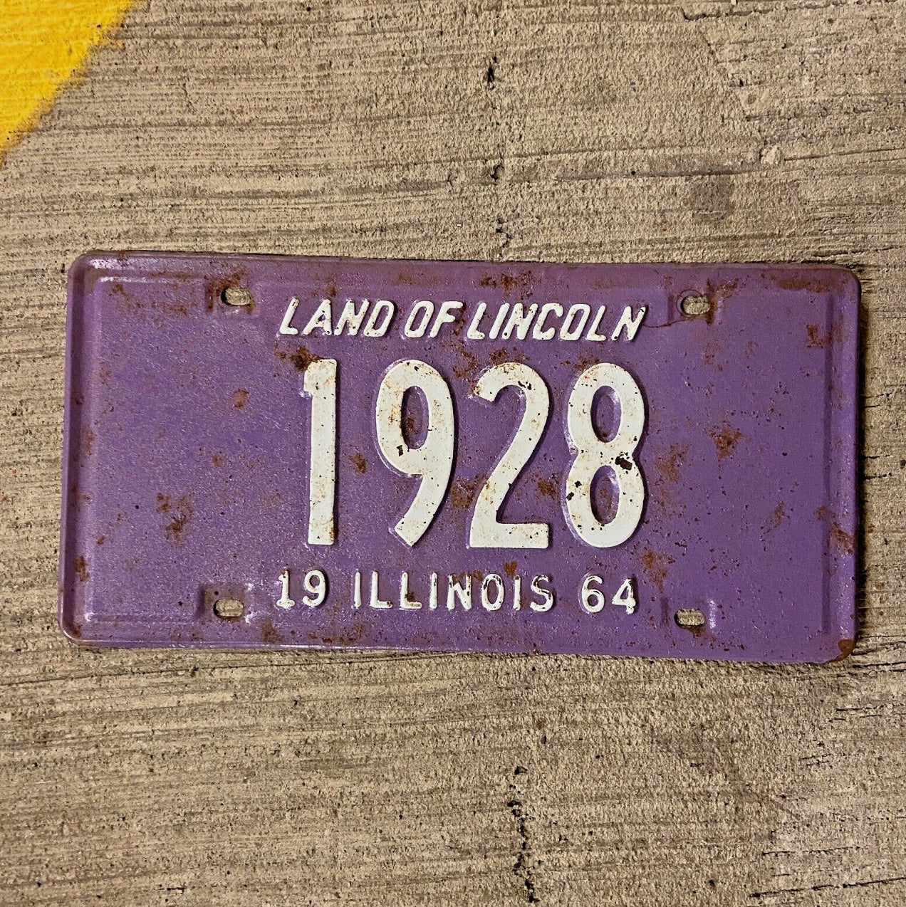 Photo of a 1964 Illinois License Plate Auto Tag Garage Decor Vintage Purple Low Number Four Digit 1928 with original patina