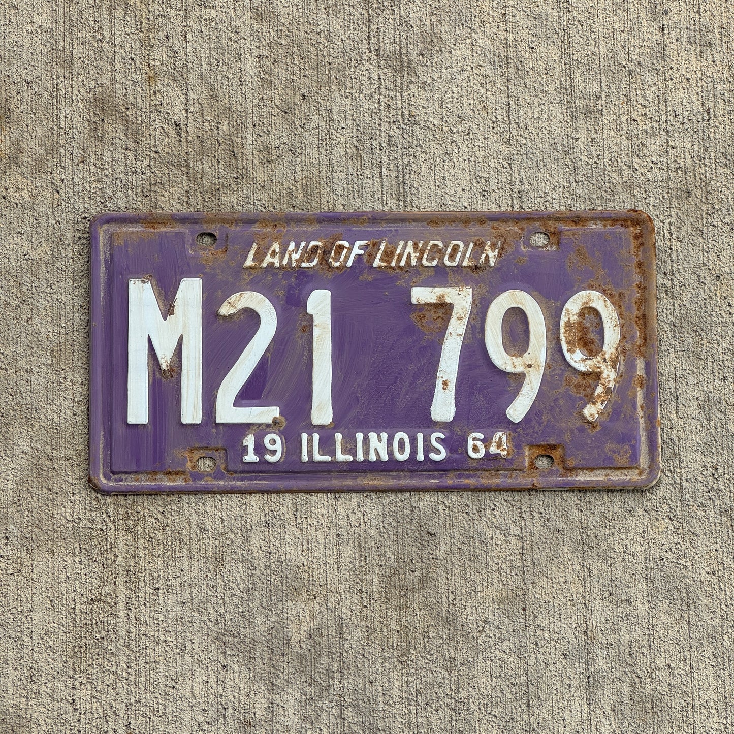 Photo of a 1964 Illinois Municipal License Plate Auto Tag 1 Vintage Garage Purple M 21 799 with original patina