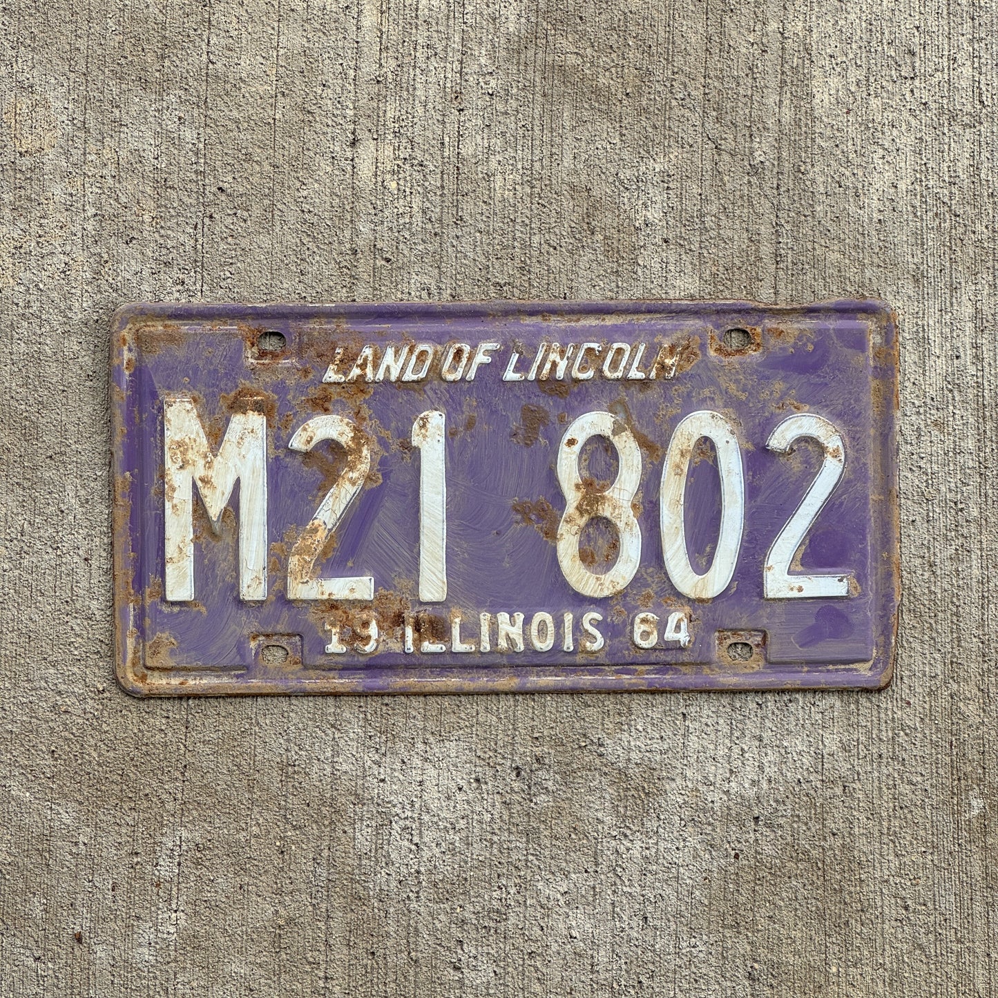 Photo of a 1964 Illinois Municipal License Plate Auto Tag 1 Vintage Garage Purple M 21 802 with original patina