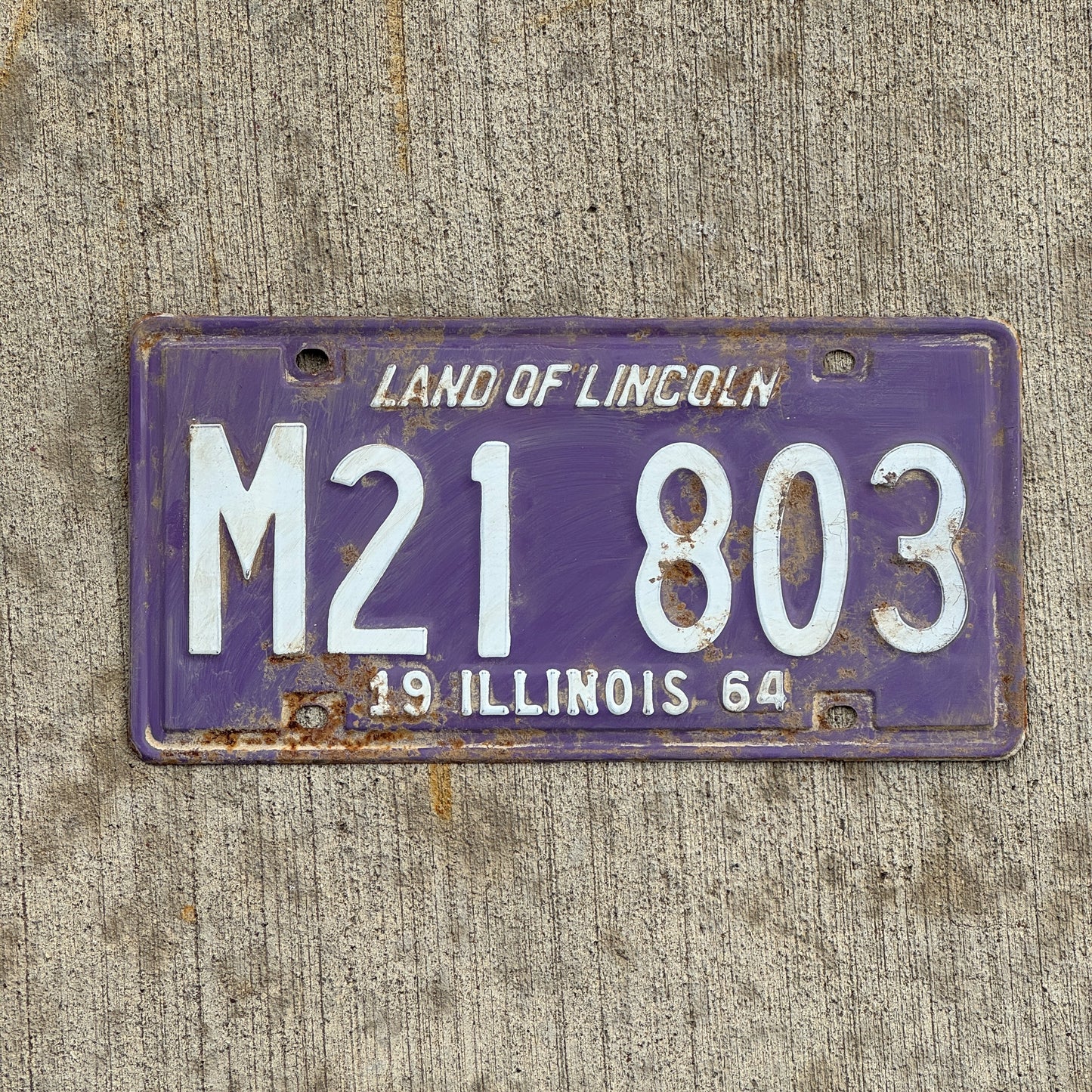Photo of a 1964 Illinois Municipal License Plate Auto Tag 1 Vintage Garage Purple M 21 803 with original patina