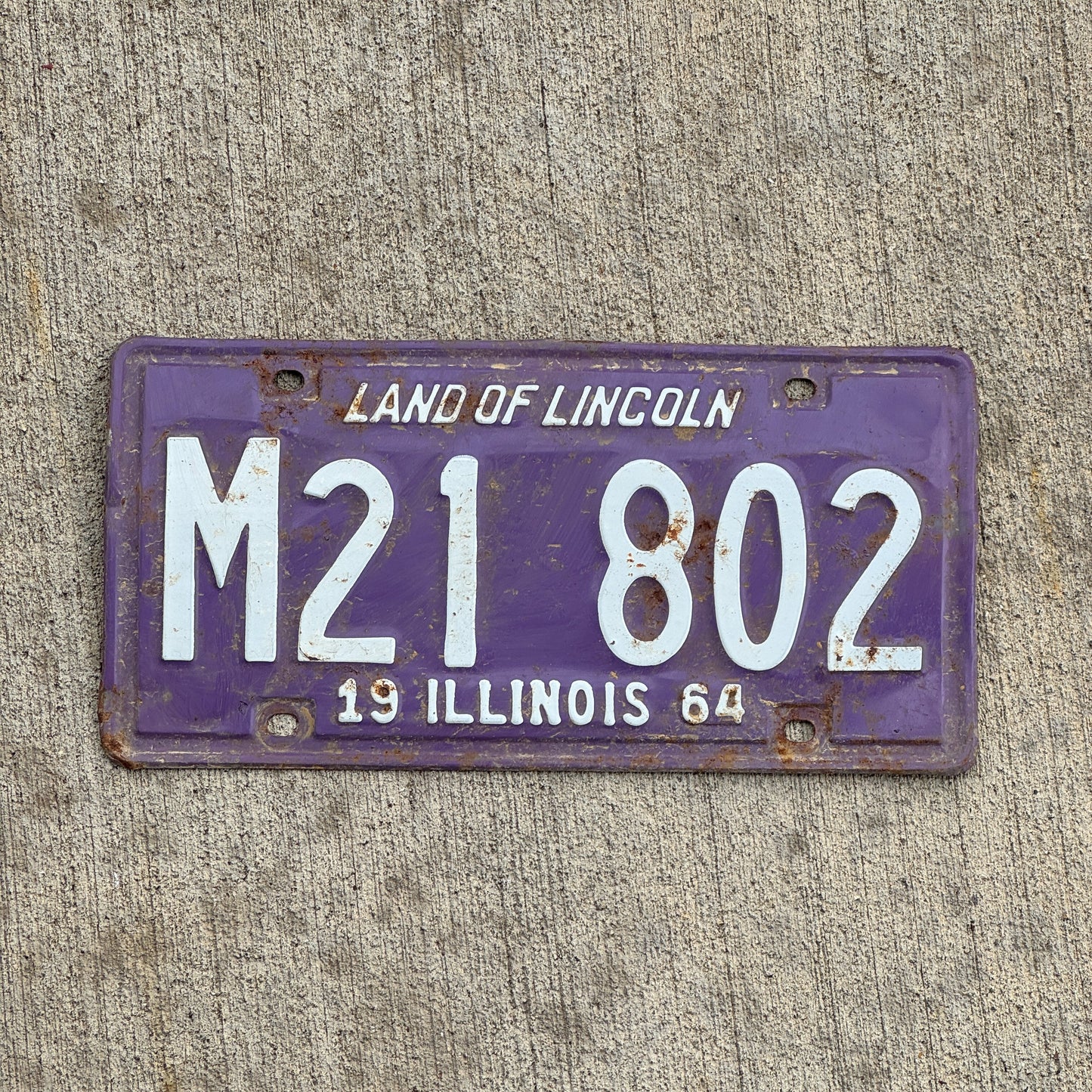 Photo of a 1964 Illinois Municipal License Plate Auto Tag 2 Vintage Garage Purple M 21 802 with original patina