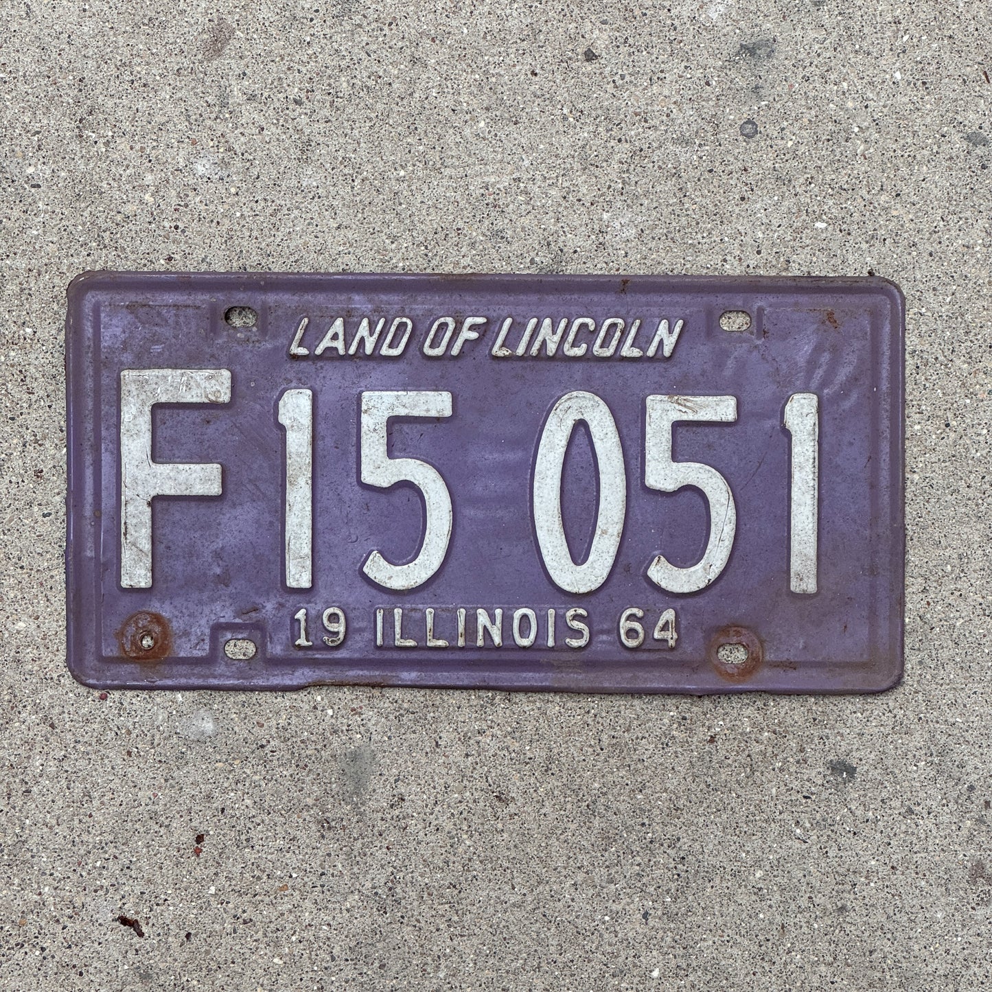 Photo of a 1964 Illinois Truck License Plate Auto Tag 2 Vintage Garage Palindrome Purple F 15 051 with original patina