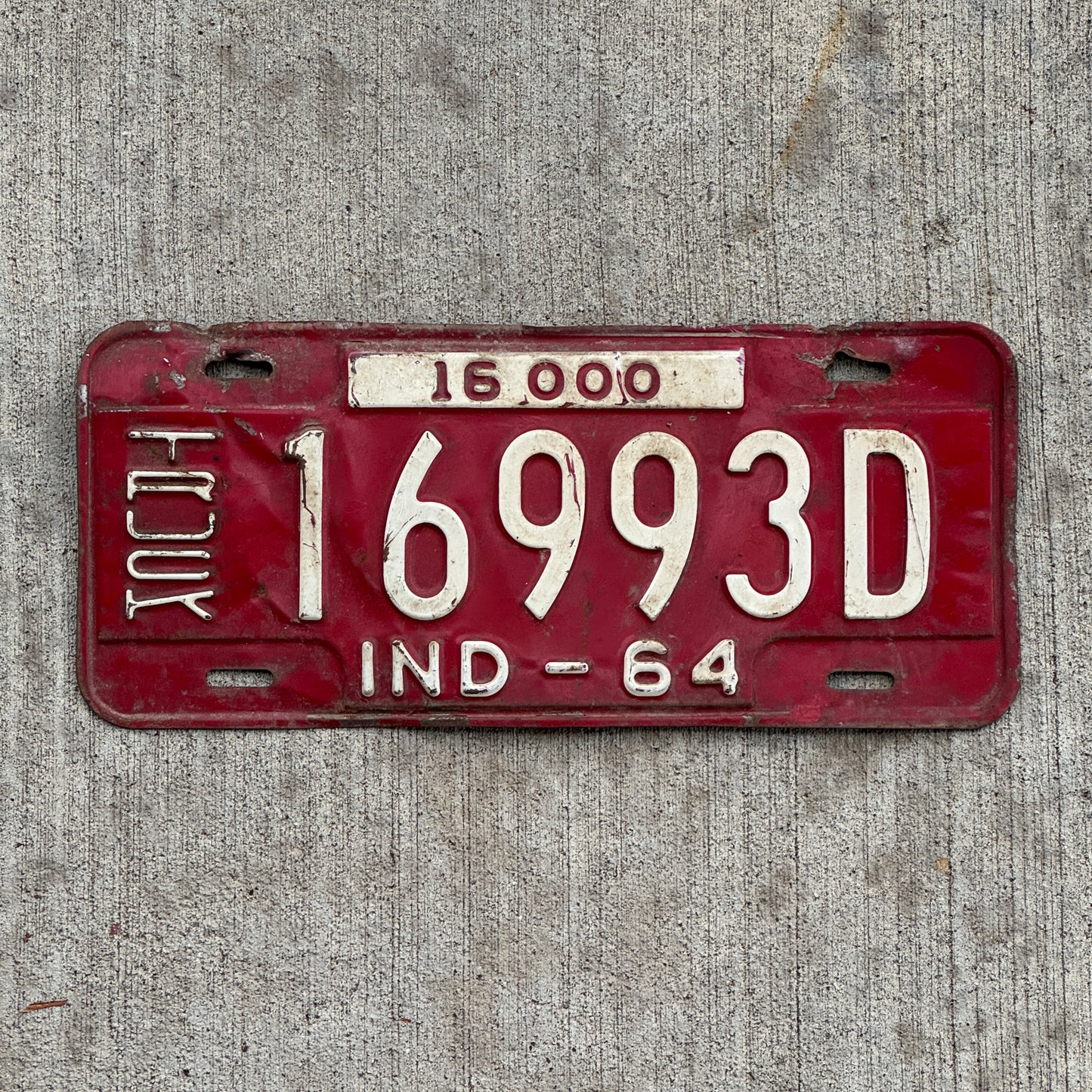 Photo of a 1964 Indiana Truck License Plate Auto Tag Garage Decor Vintage 16993 D with original patina