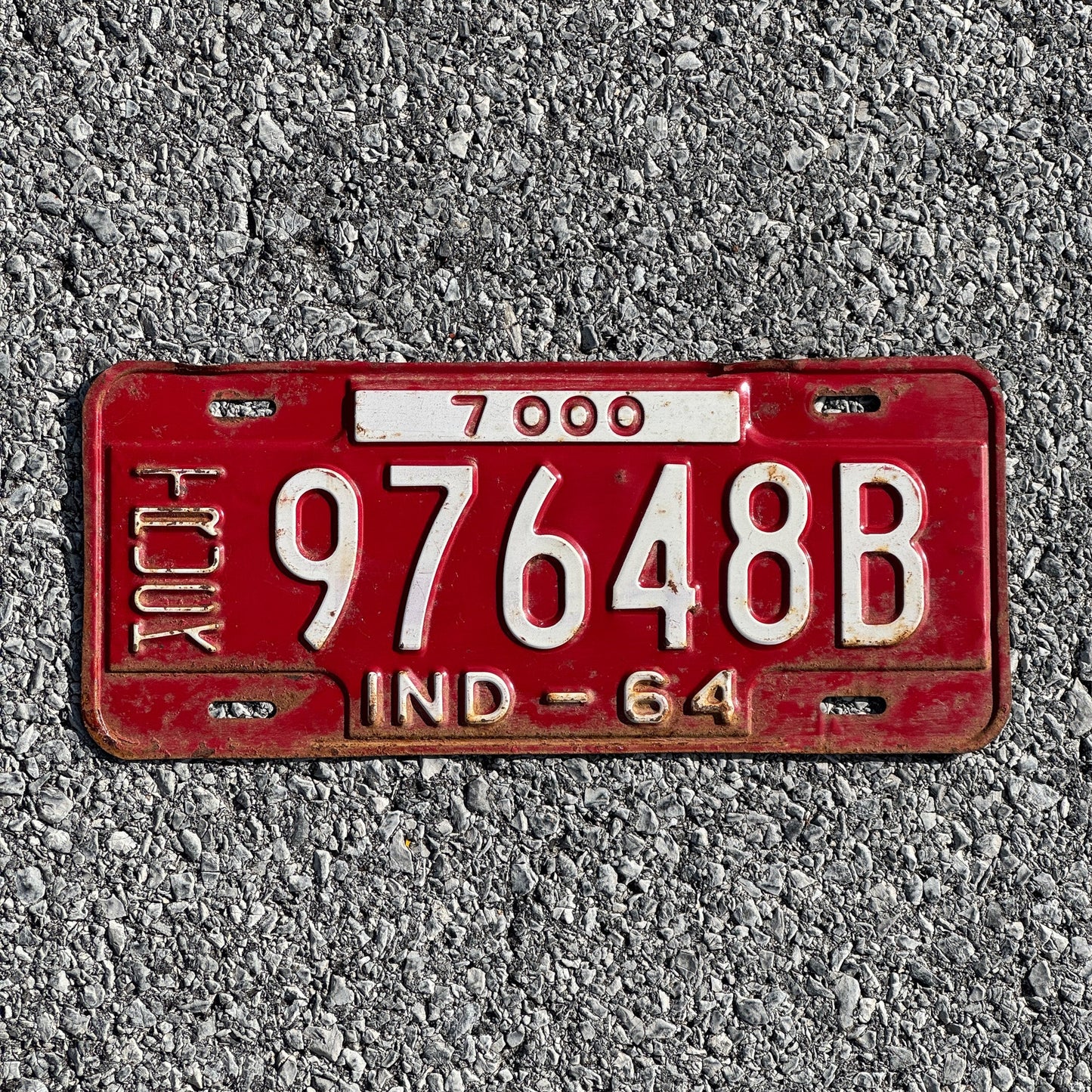 Photo of a 1964 Indiana Truck License Plate Auto Tag Garage Decor Vintage 97648B