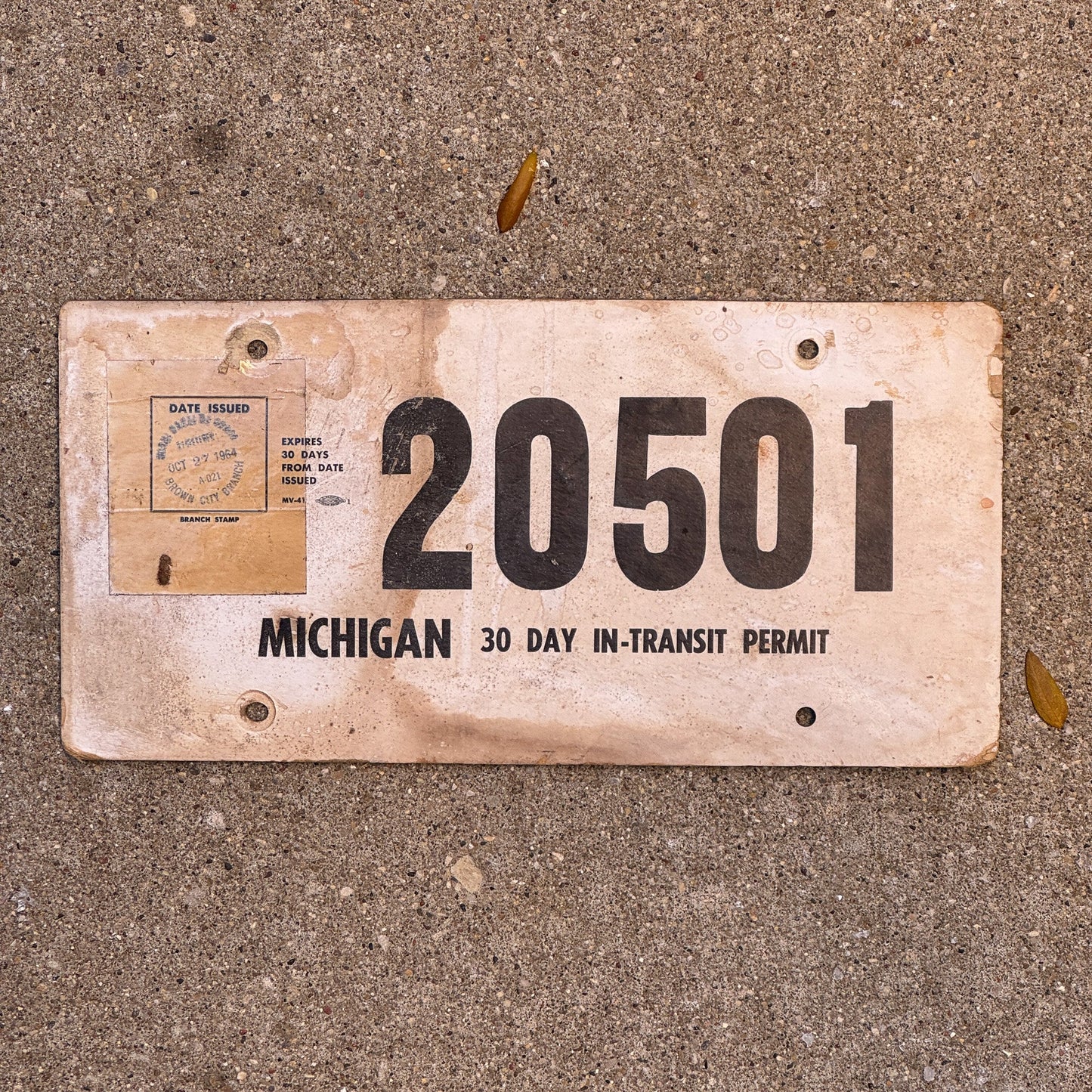 Photo of a 1964 Michigan Temporary License Plate Auto Tag Garage Decor Vintage 20501 with original patina