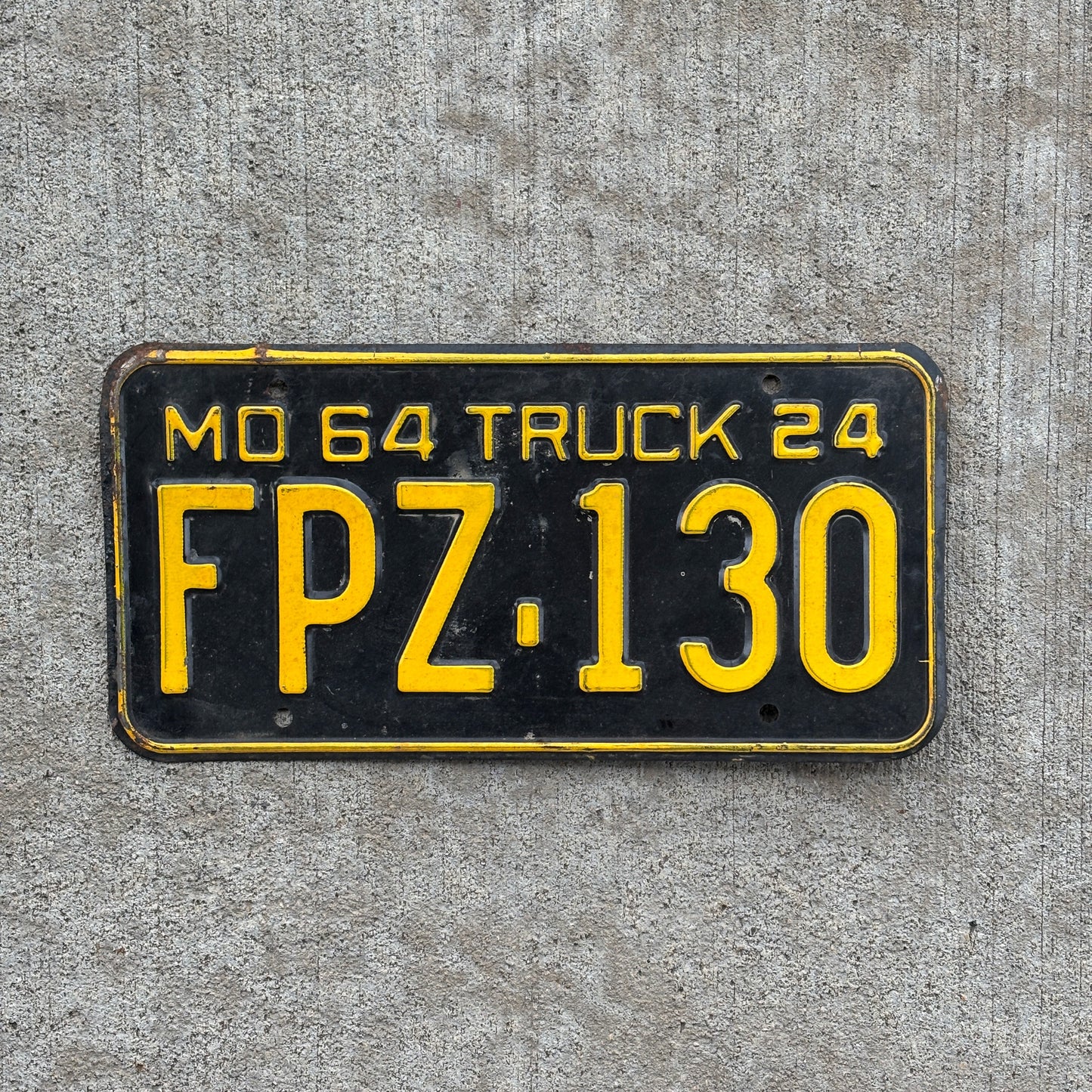 Photo of a 1964 Missouri Truck License Plate Auto Tag Garage Decor Vintage FPZ 130 with original patina