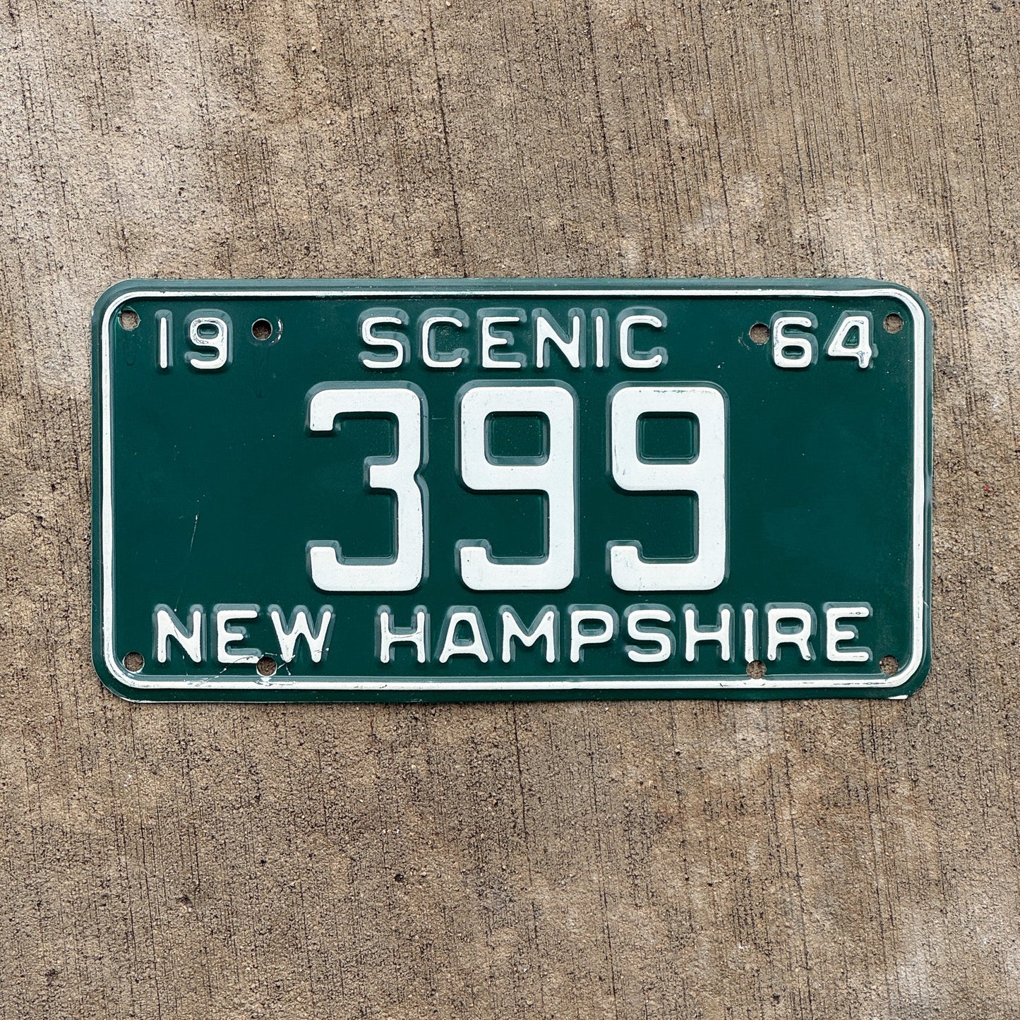 Photo of a 1964 New Hampshire License Plate Auto Tag 1 Vintage Garage Low Number Three Digit 399 with original patina