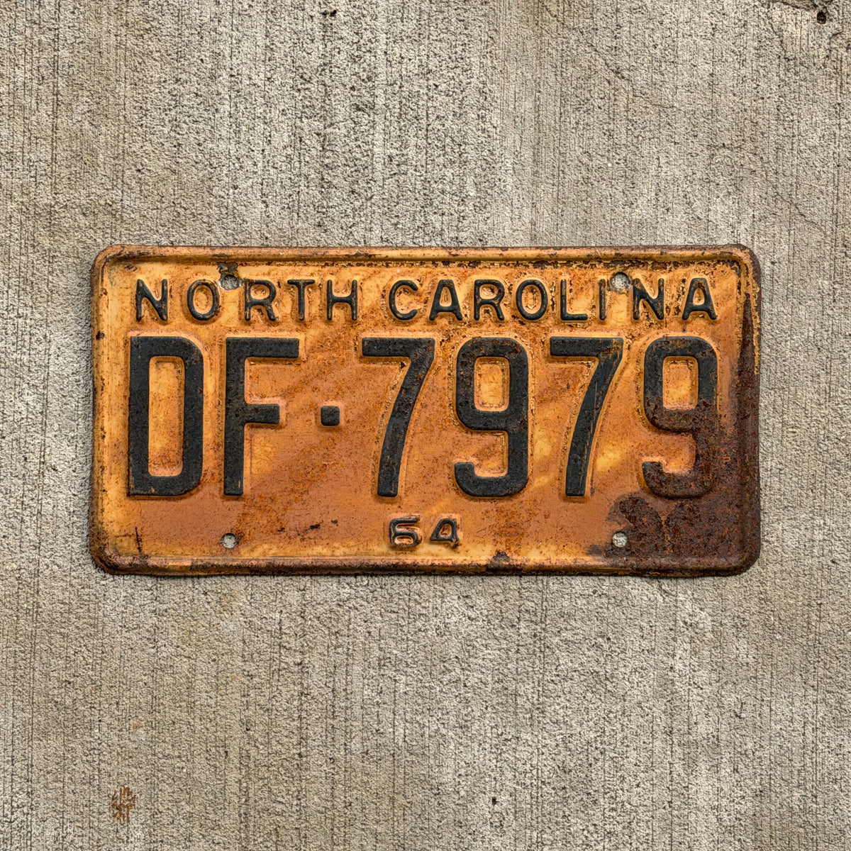 Photo of a 1964 North Carolina License Plate Auto Tag Garage Decor Vintage DF 7979 with original patina