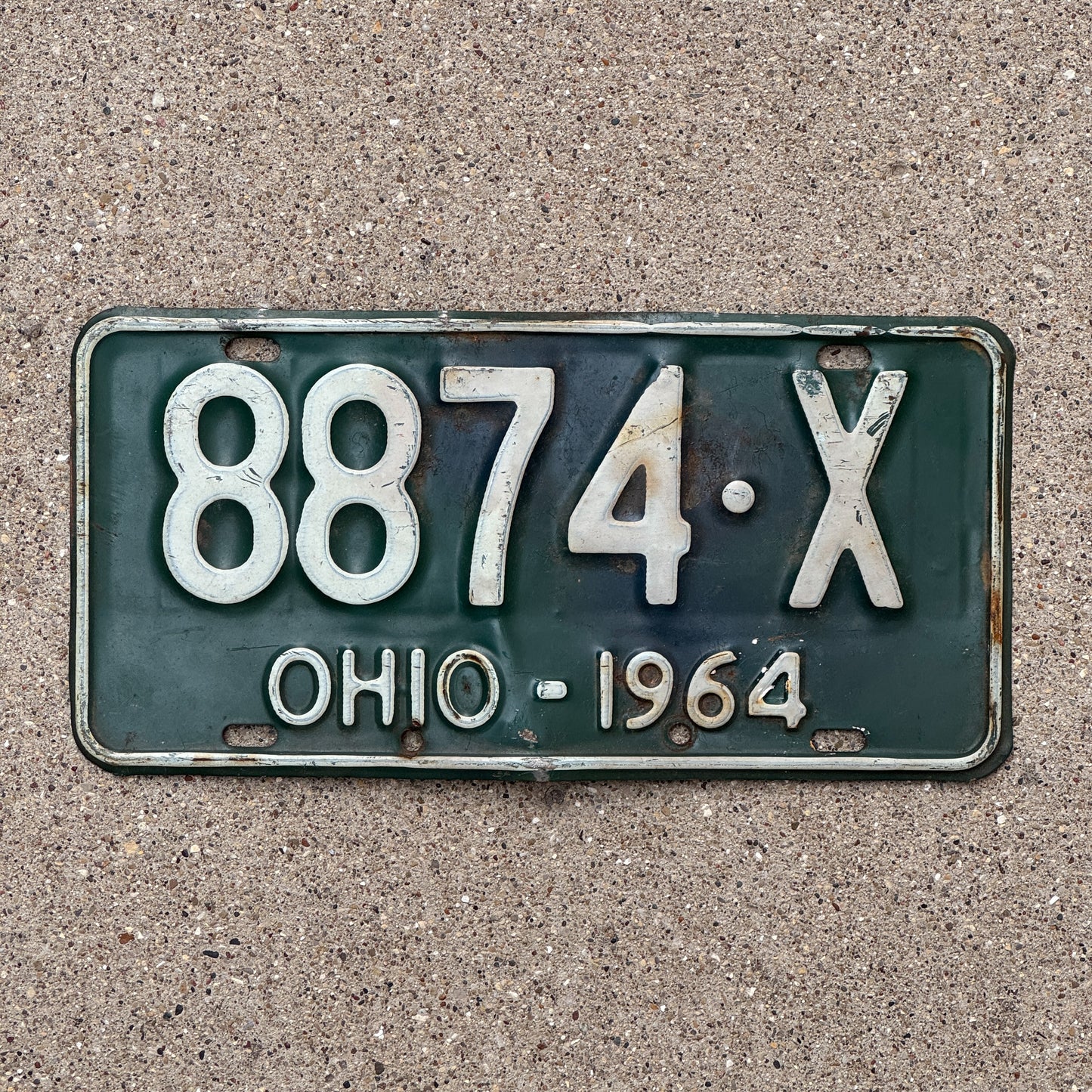 Photo of a 1964 Ohio License Plate Auto Tag Garage Decor Vintage 8874 X with original patina