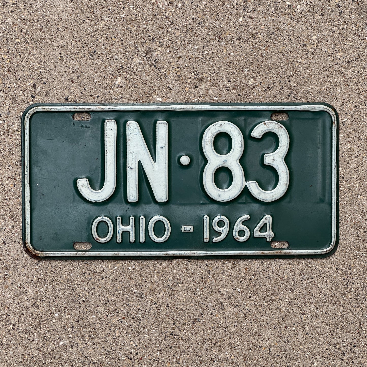 Photo of a 1964 Ohio License Plate Auto Tag Garage Decor Vintage JN 83 with original patina