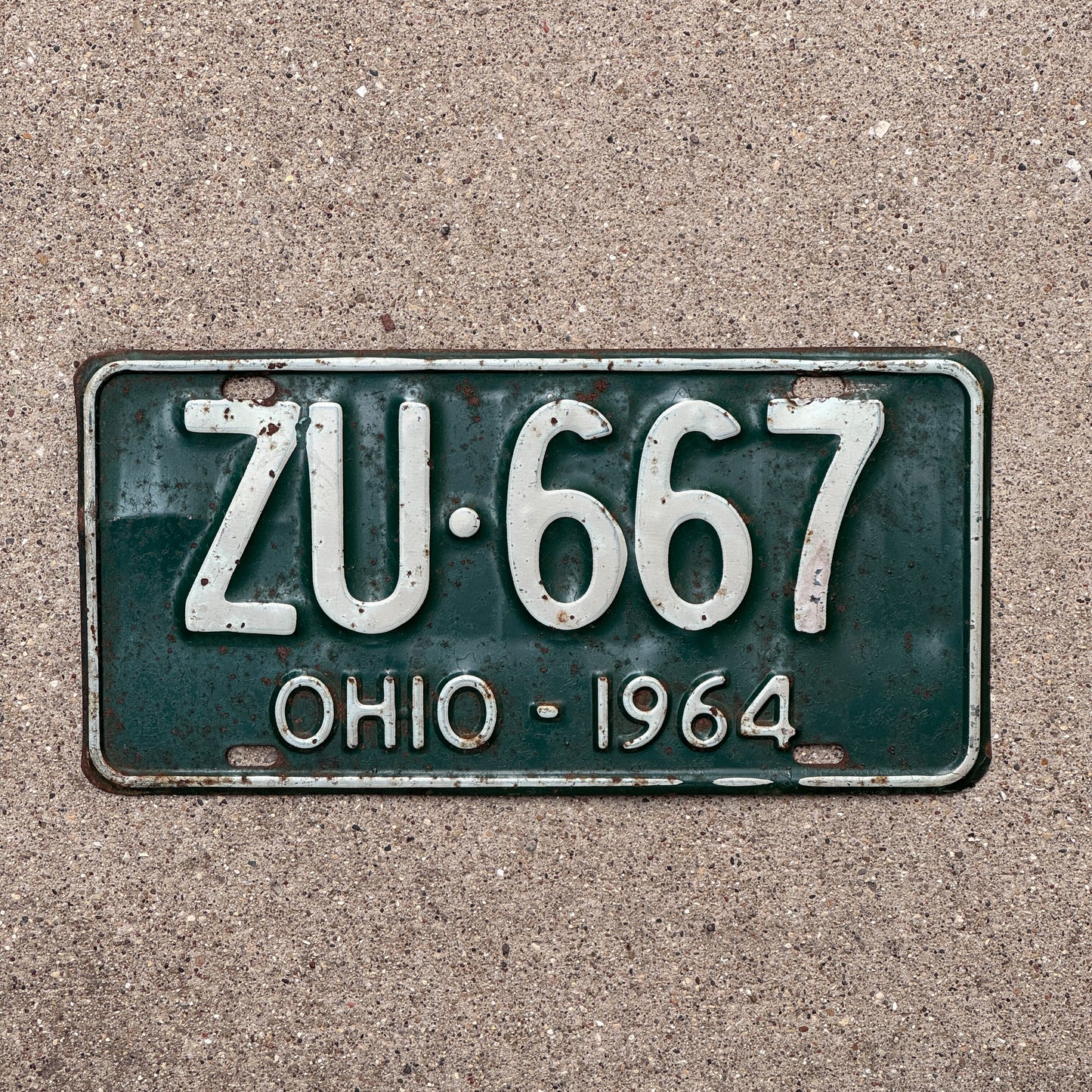 Photo of a 1964 Ohio License Plate Auto Tag Garage Decor Vintage ZU 667 with original patina