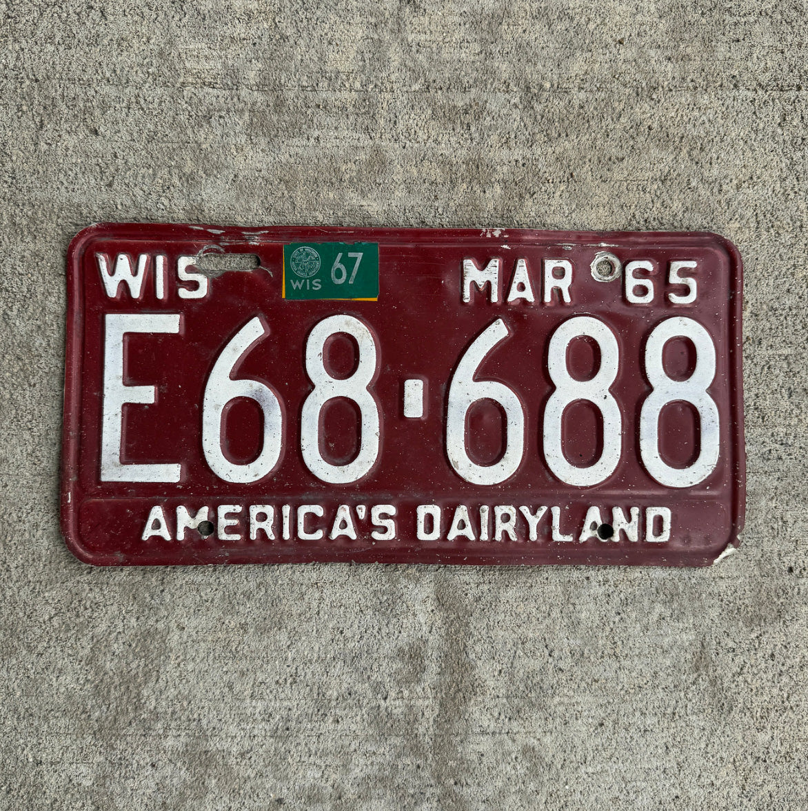 Photo of a 1965 1967 Wisconsin License Plate Auto Tag Garage Decor Vintage E 68 688 with original patina