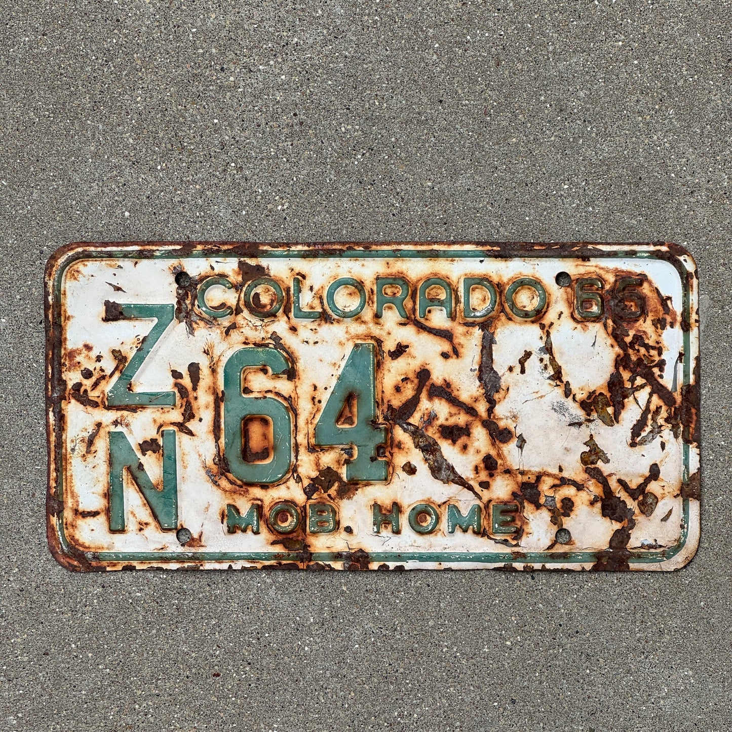 Photo of a 1965 Colorado Mobile Home License Plate Auto Tag Garage Decor Vintage ZN 64