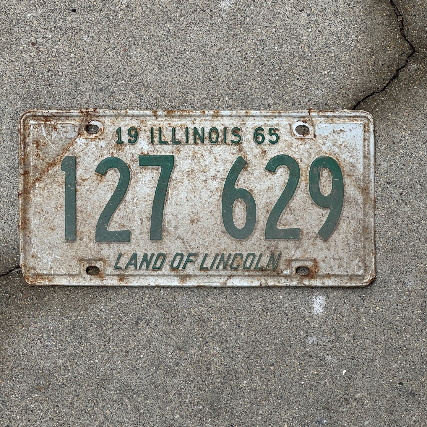 Photo of a 1965 Illinois License Plate Auto Tag 1 Vintage Garage 127 629 with original patina