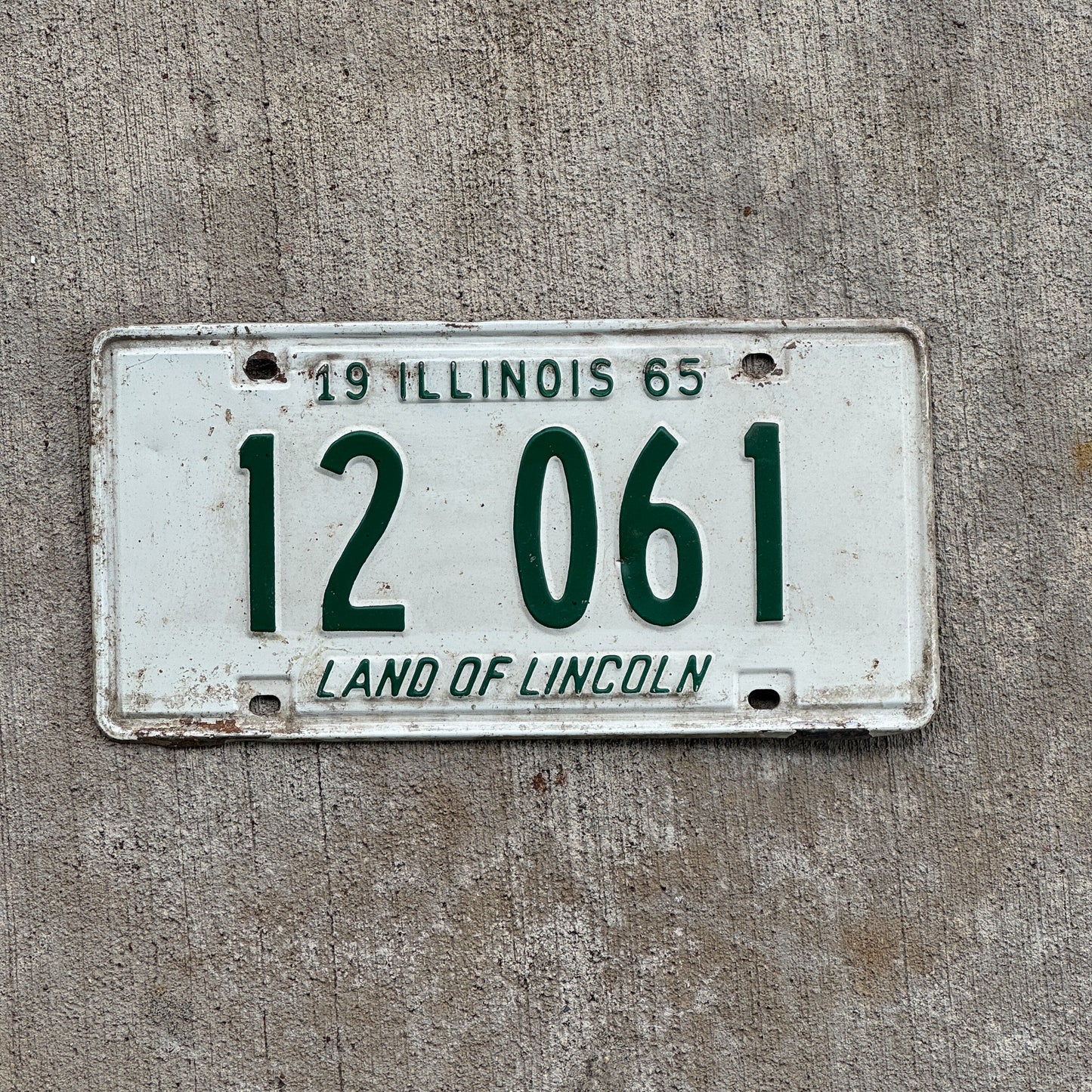 Photo of a 1965 Illinois License Plate Auto Tag 2 Vintage Garage 12 061 with original patina