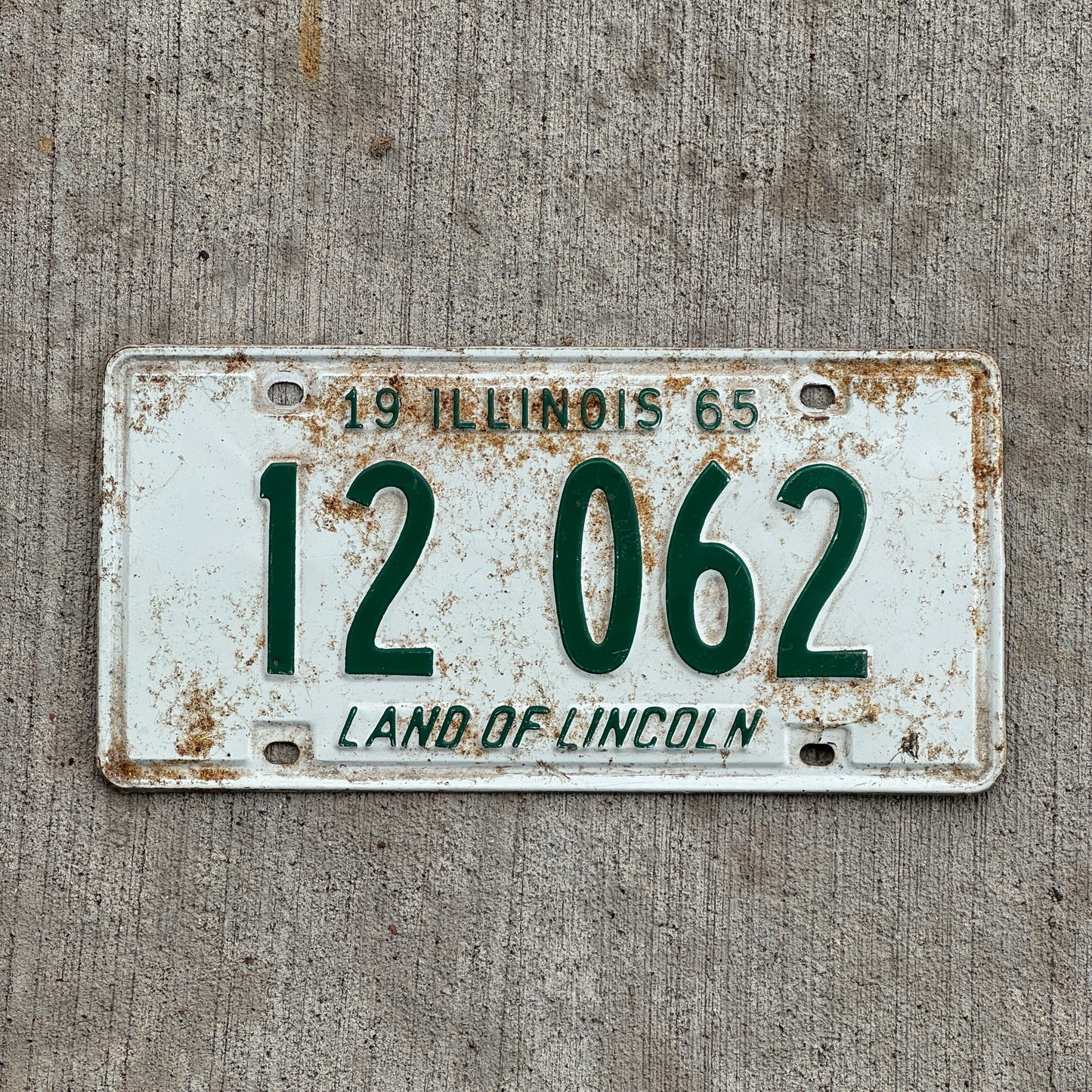Photo of a 1965 Illinois License Plate Auto Tag Garage Decor Vintage 12 062 with original patina