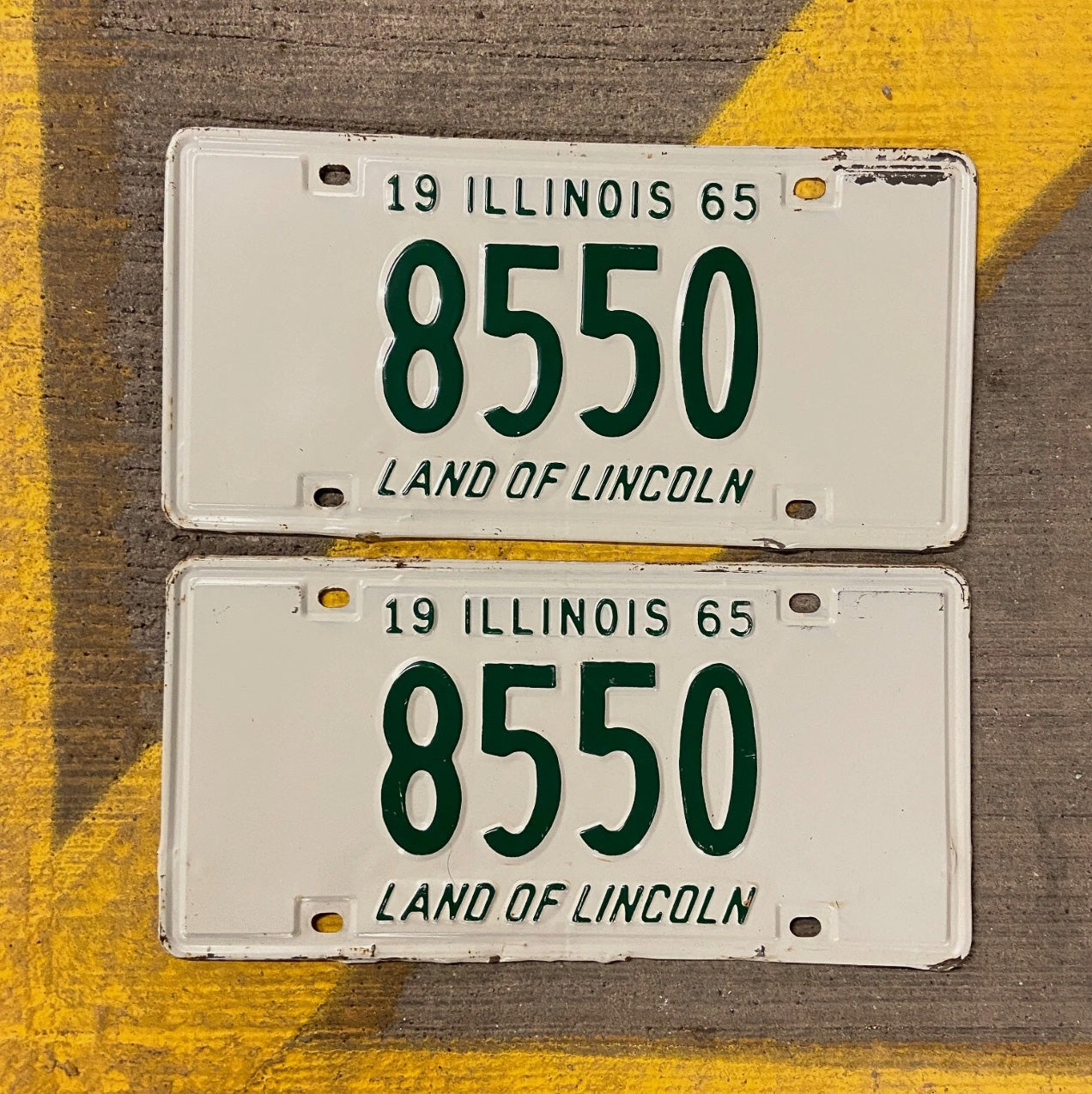 Photo of a 1965 Illinois License Plate Pair Auto Tag Garage Decor Vintage Low Number Four Digit 8550 with original patina