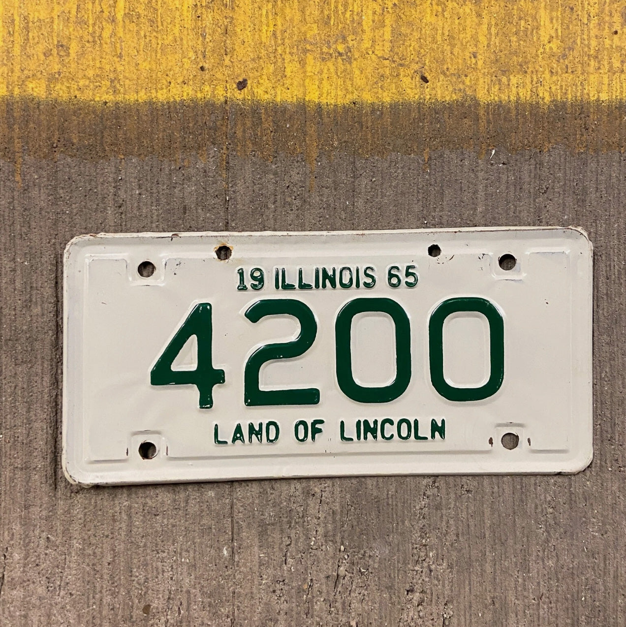 Photo of a 1965 Illinois Motorcycle License Plate Auto Tag Garage Decor Vintage Low Number Four Digit 420 Weed 4200 with original patina