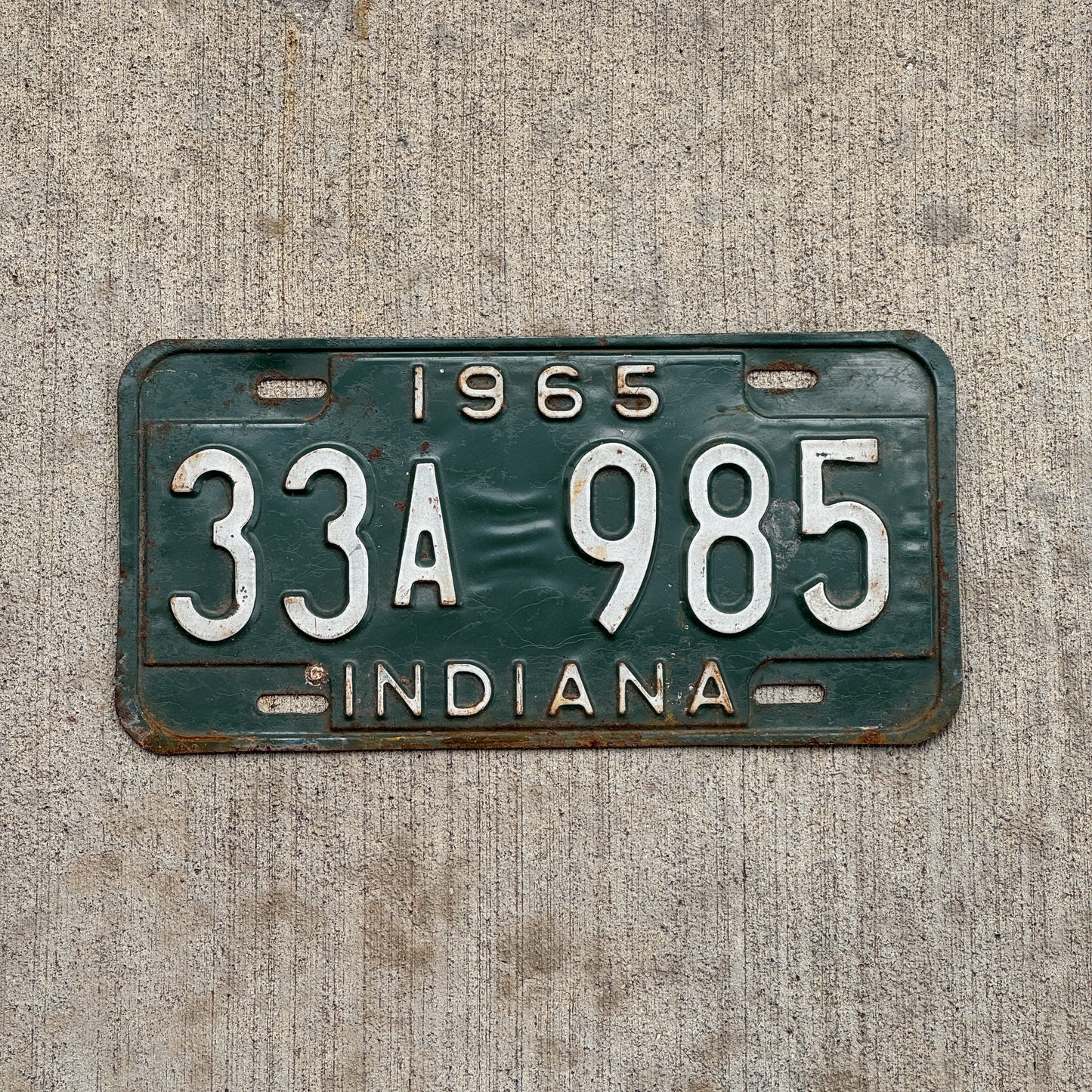 Photo of a 1965 Indiana License Plate Auto Tag Garage Decor Vintage 33 A 985 with original patina