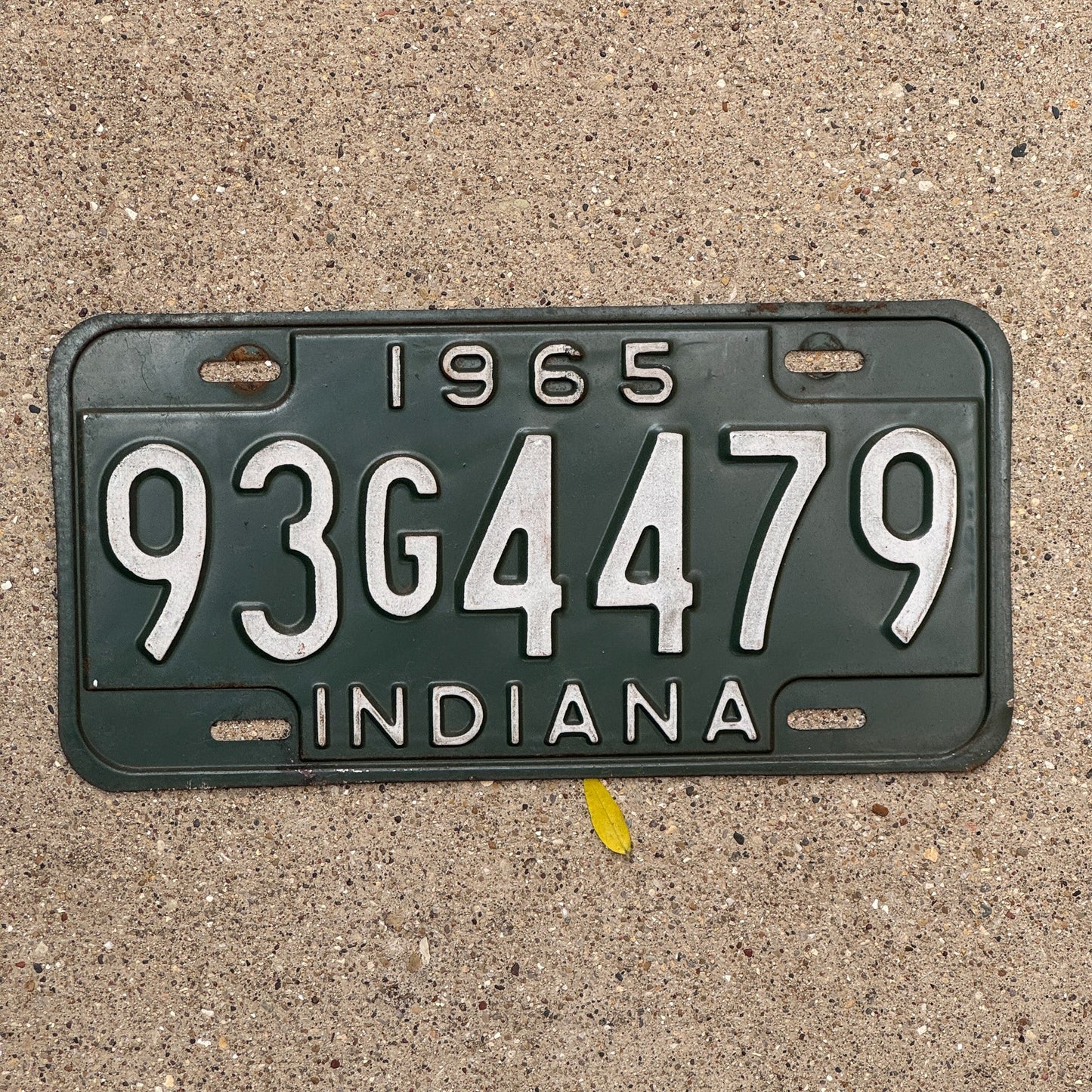 Photo of a 1965 Indiana License Plate Auto Tag Garage Decor Vintage 93 G 4479 with original patina
