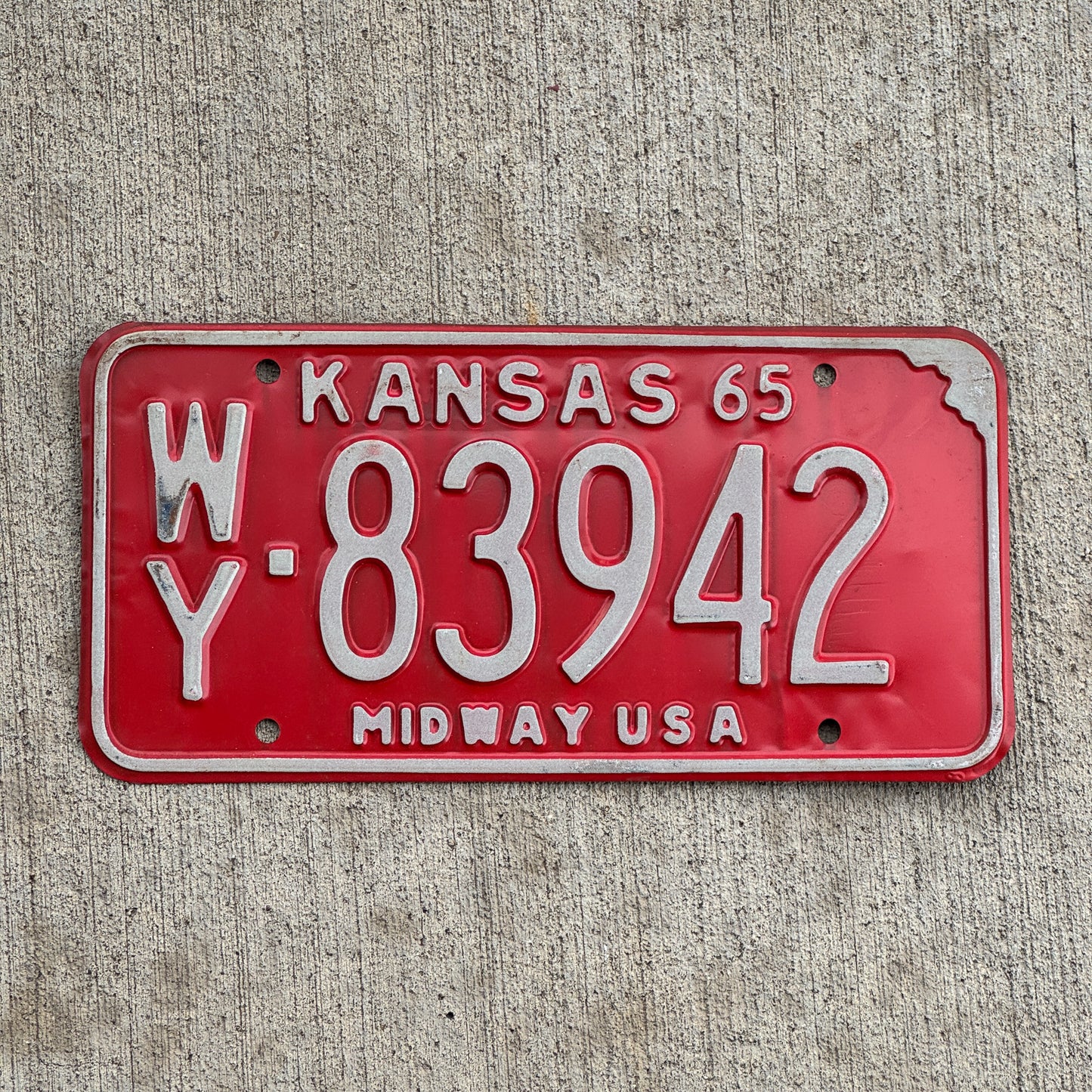 Photo of a 1965 Kansas License Plate Auto Tag Garage Decor Vintage WY 83942 with original patina