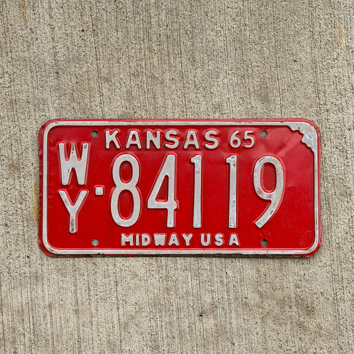 Photo of a 1965 Kansas License Plate Auto Tag Garage Decor Vintage WY 84119 with original patina