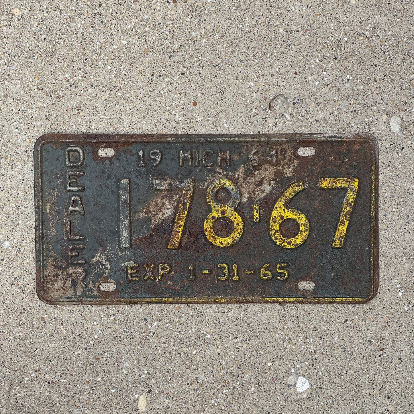 Photo of a 1965 Michigan Dealer License Plate Auto Tag Garage Decor Vintage 17867