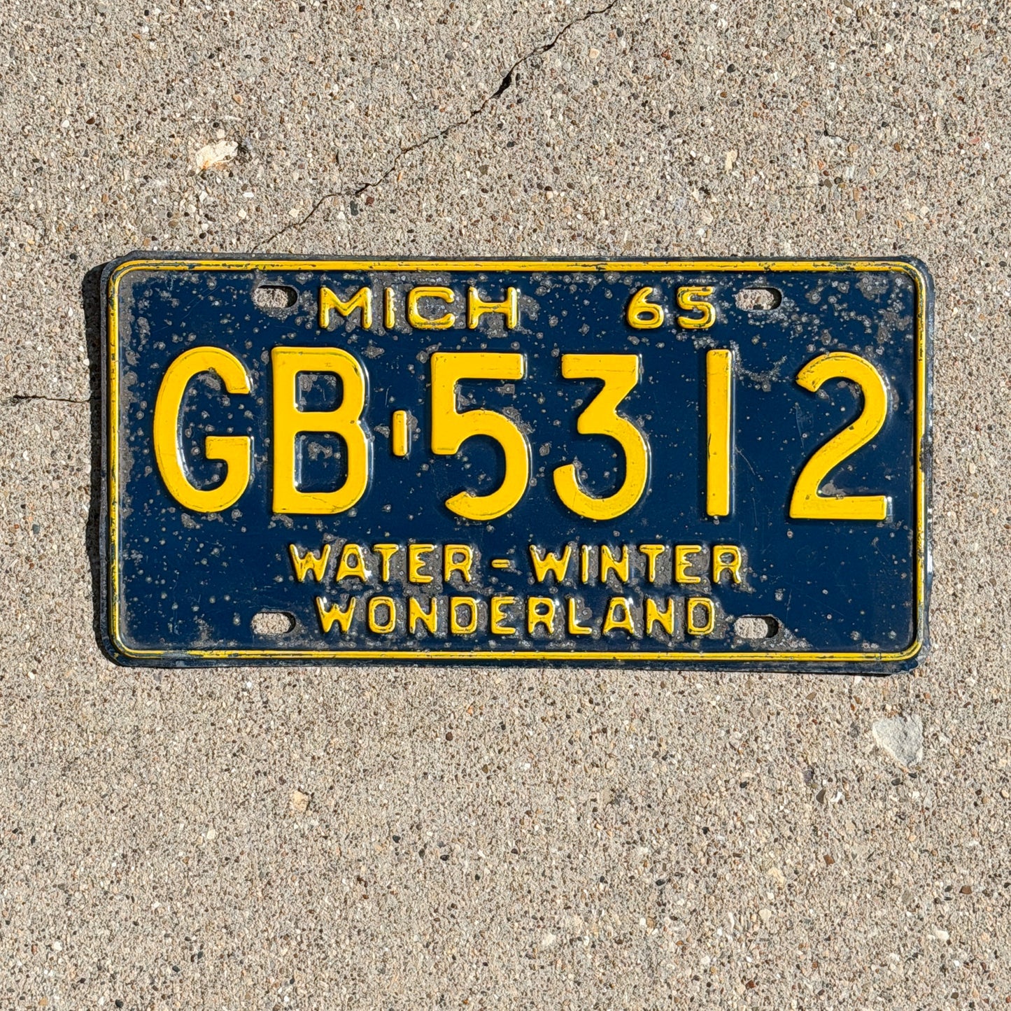 Photo of a 1965 Michigan License Plate Auto Tag Garage Decor Vintage GB 5312 with original patina