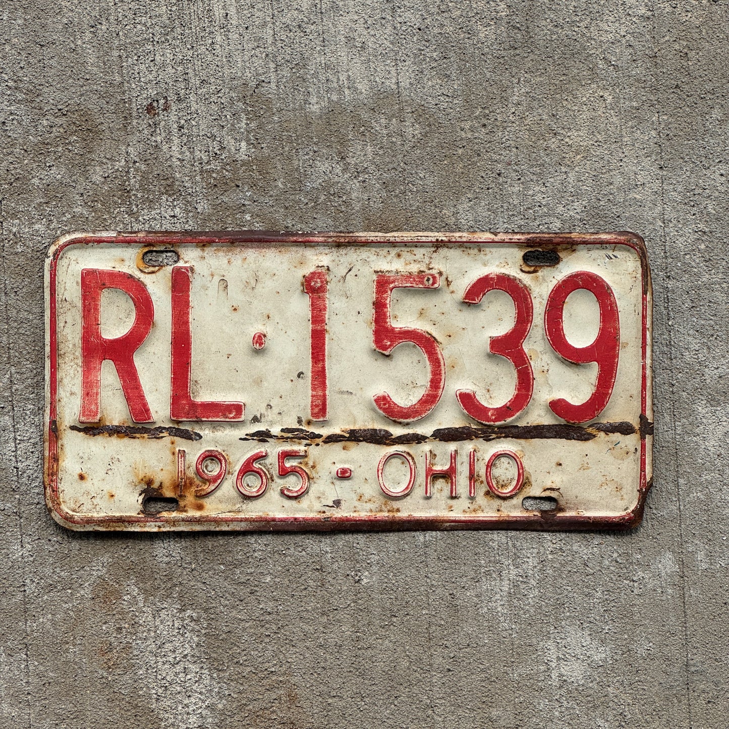 Photo of a 1965 Ohio License Plate Auto Tag Garage Decor Vintage RL 1539 with original patina