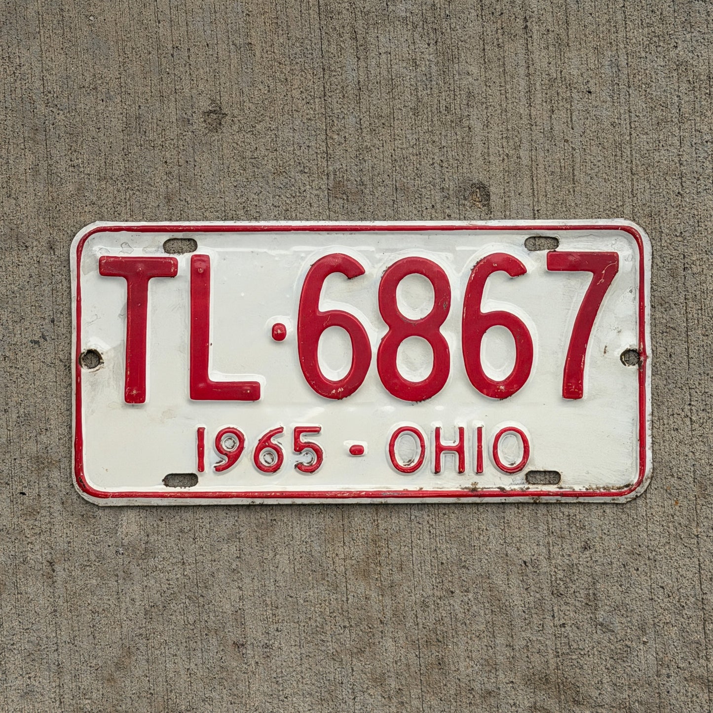 Photo of a 1965 Ohio License Plate Auto Tag Garage Decor Vintage TL 6867 with original patina