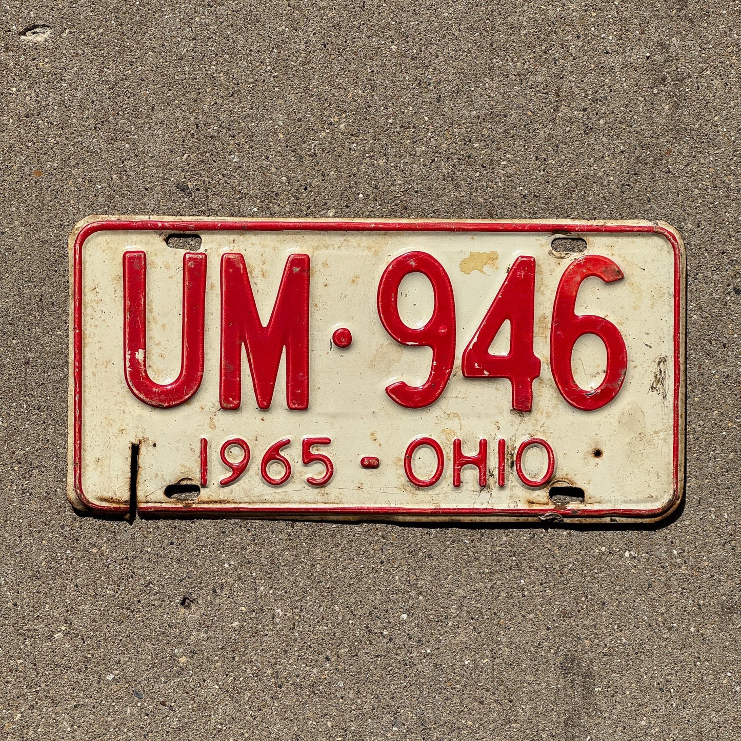 Photo of a 1965 Ohio License Plate Auto Tag Garage Decor Vintage UM 946
