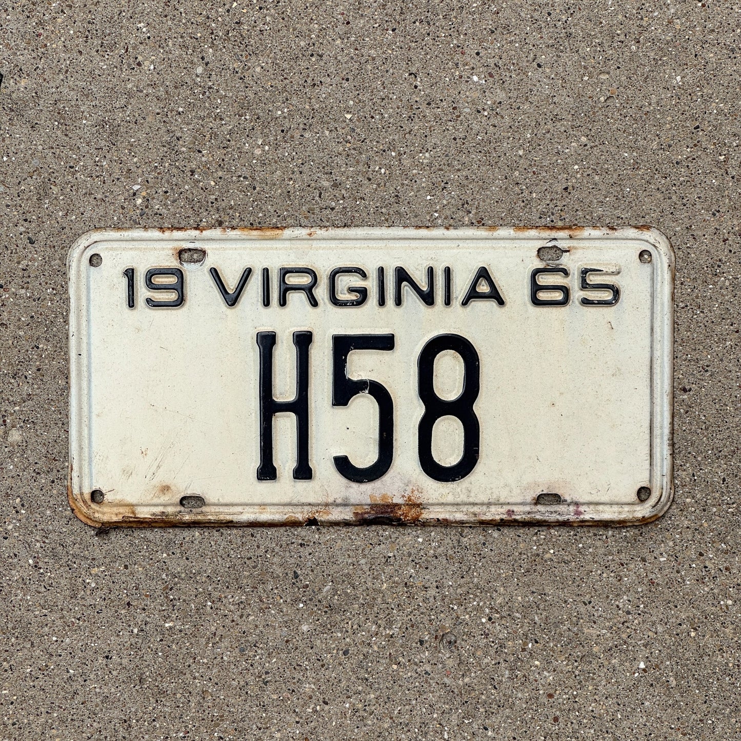 Photo of a 1965 Virginia Taxi Cab License Plate Auto Tag Garage Decor Vintage Low Number Two Digit H 58