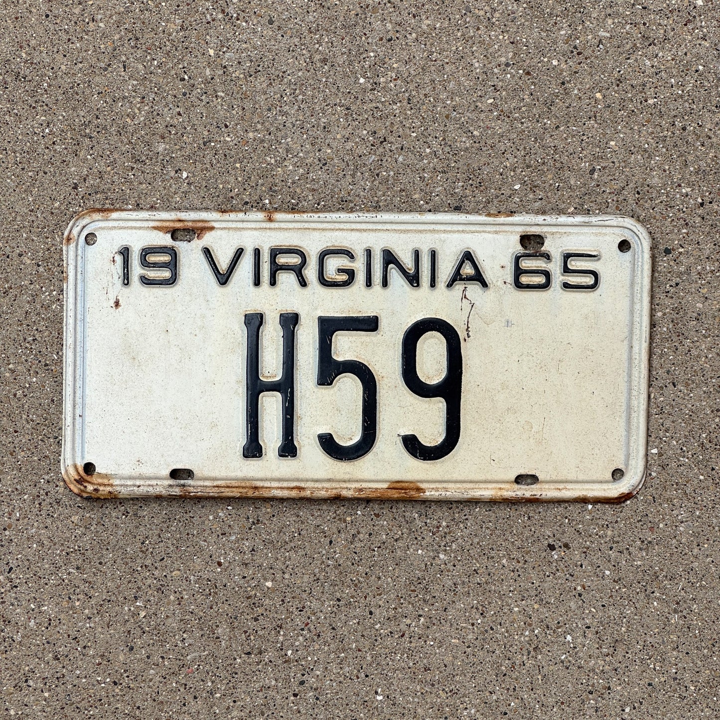 Photo of a 1965 Virginia Taxi Cab License Plate Auto Tag Garage Decor Vintage Low Number Two Digit H 59