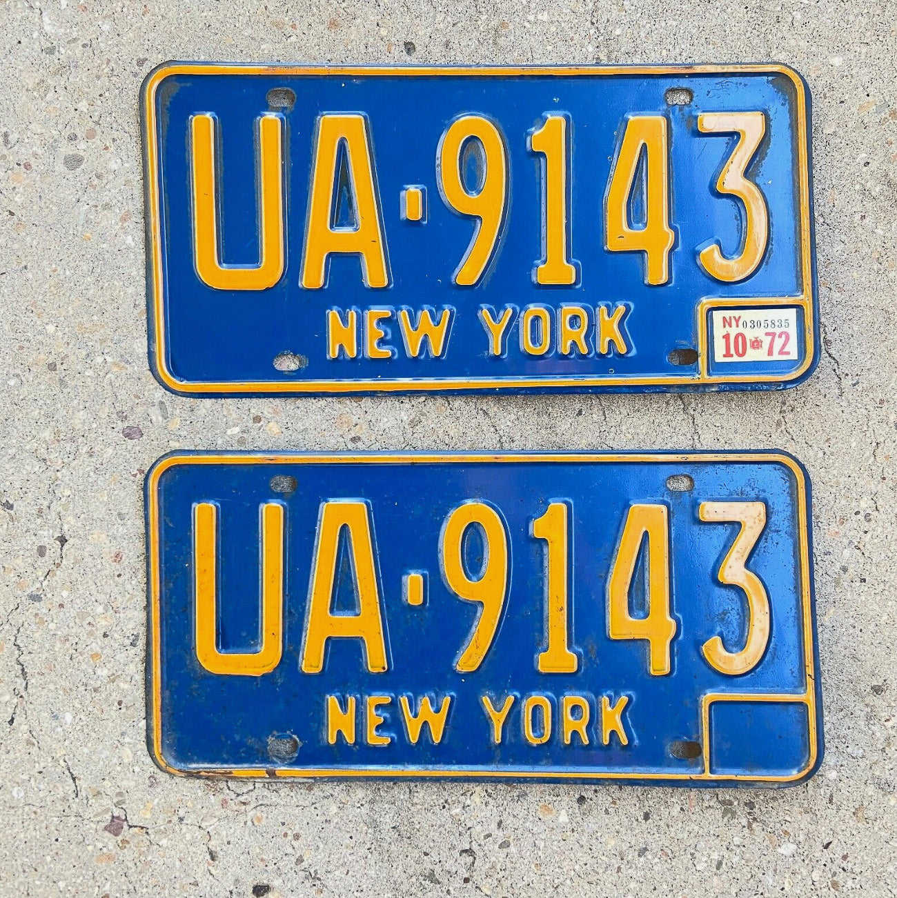 Photo of a 1966 1973 New York License Plate Pair Auto Tag Garage Decor Vintage YOM DMV Clear UA 9143 with original patina
