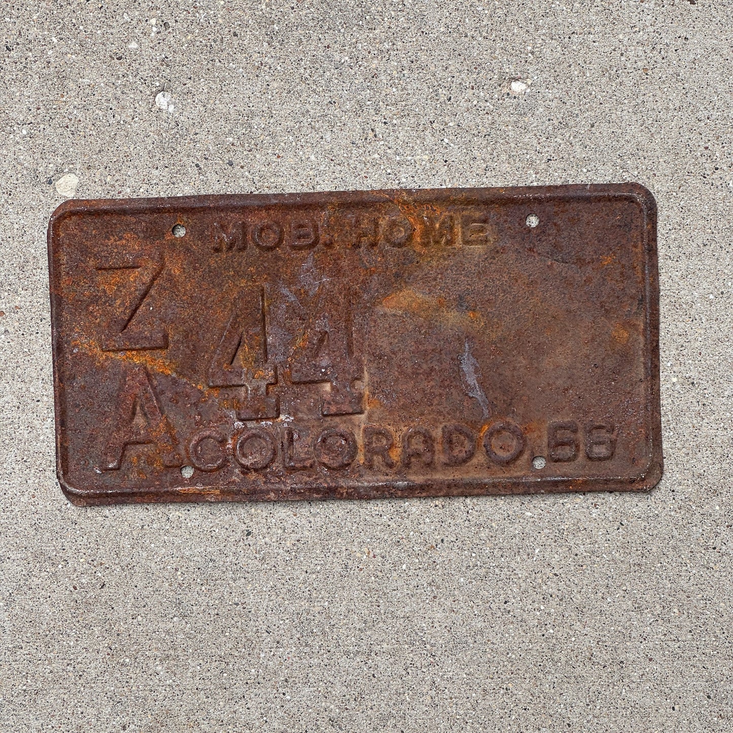 Photo of a 1966 Colorado Mobile Home License Plate Auto Tag Garage Decor Vintage ZA 44