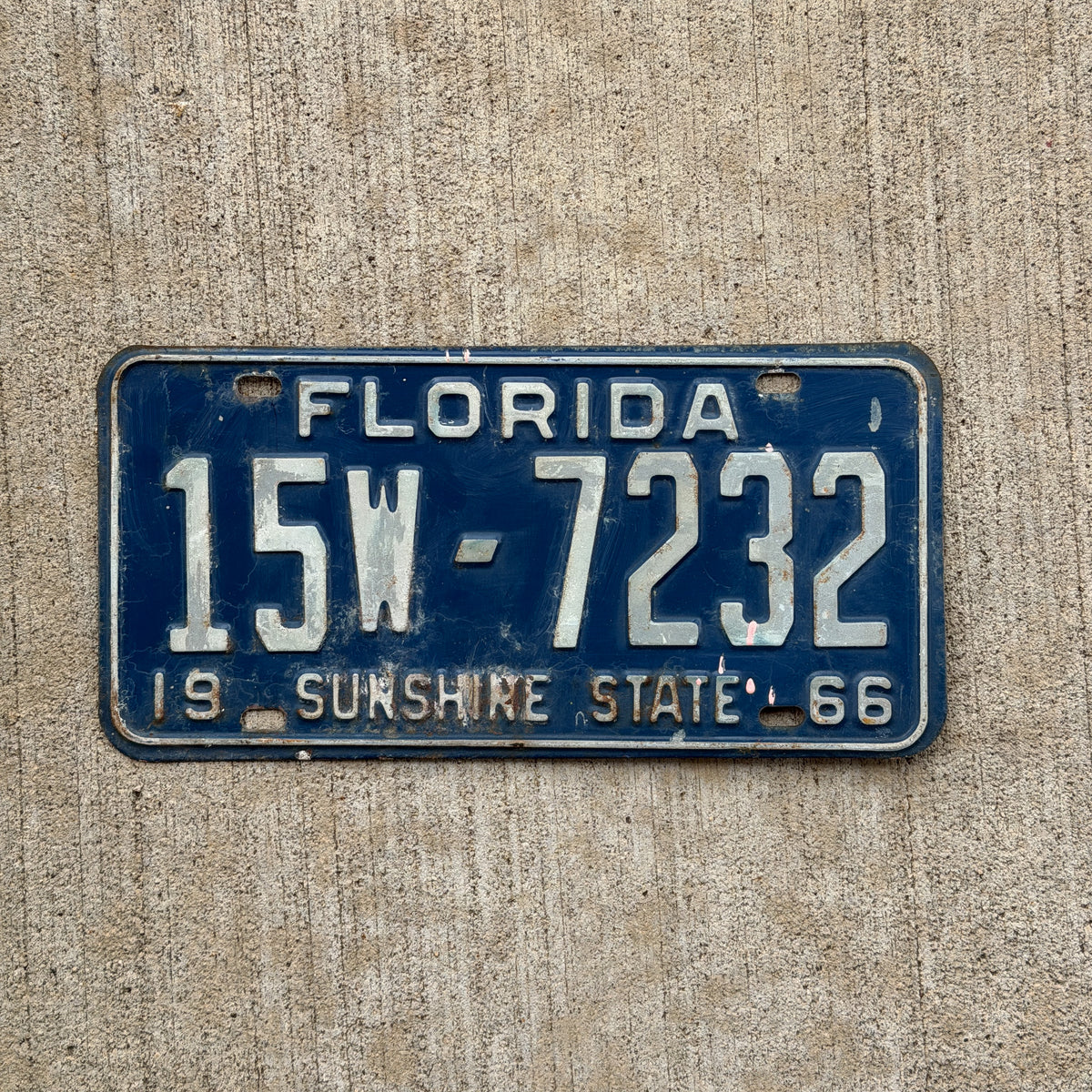 Photo of a 1966 Florida License Plate Auto Tag Garage Decor Vintage DMV Clear Number 15W 7232 with original patina