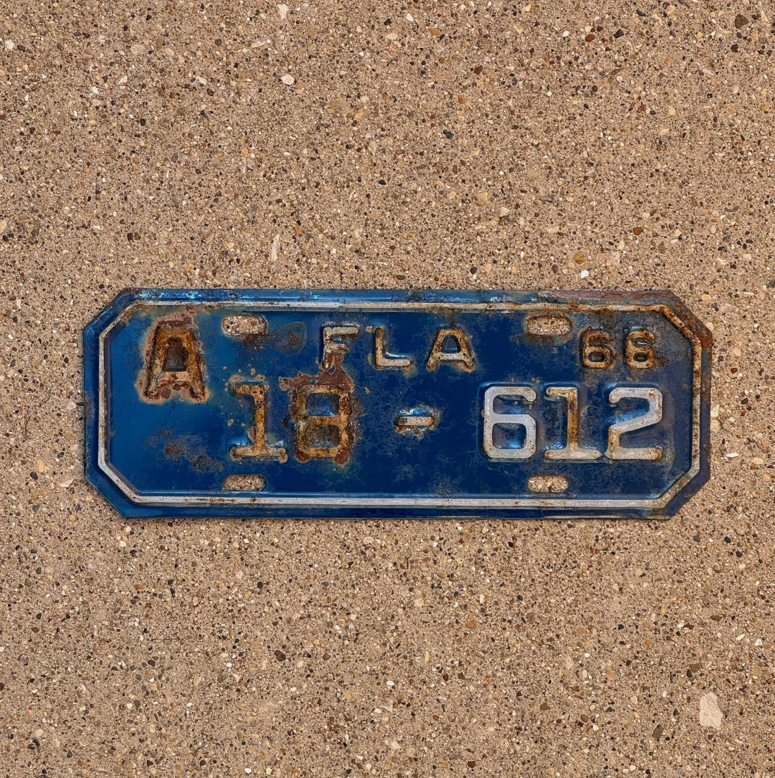 Photo of a 1966 Florida Motorcycle License Plate Auto Tag Garage Decor Vintage Lee County 3 Digit 18 612 with original patina